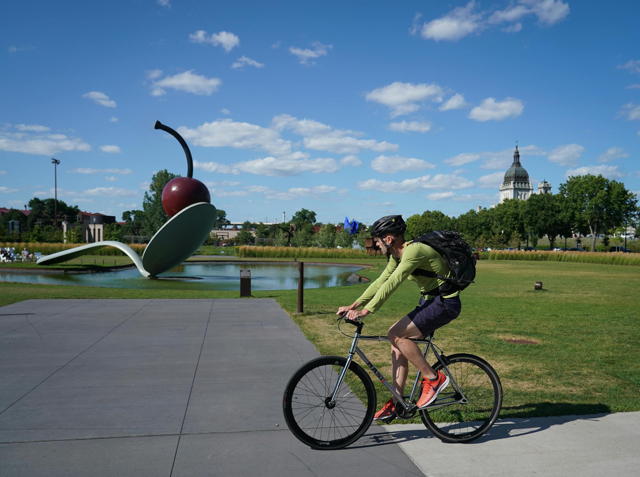 Bicyclists rode through the Minneapolis Sculpture Garden on Thursday, August 8, 2019. With Southwest Light Rail Construction, bikers that typically commute to work in and out of the cities have been forced off of bike trails (like Cedar Lake) and into spots where they generally wouldn't be, like Loring Park or the Minneapolis Sculpture Garden. ] Shari L. Gross • shari.gross@startribune.com With Southwest Light Rail Construction, bikers that typically commute to work in and out of the citi