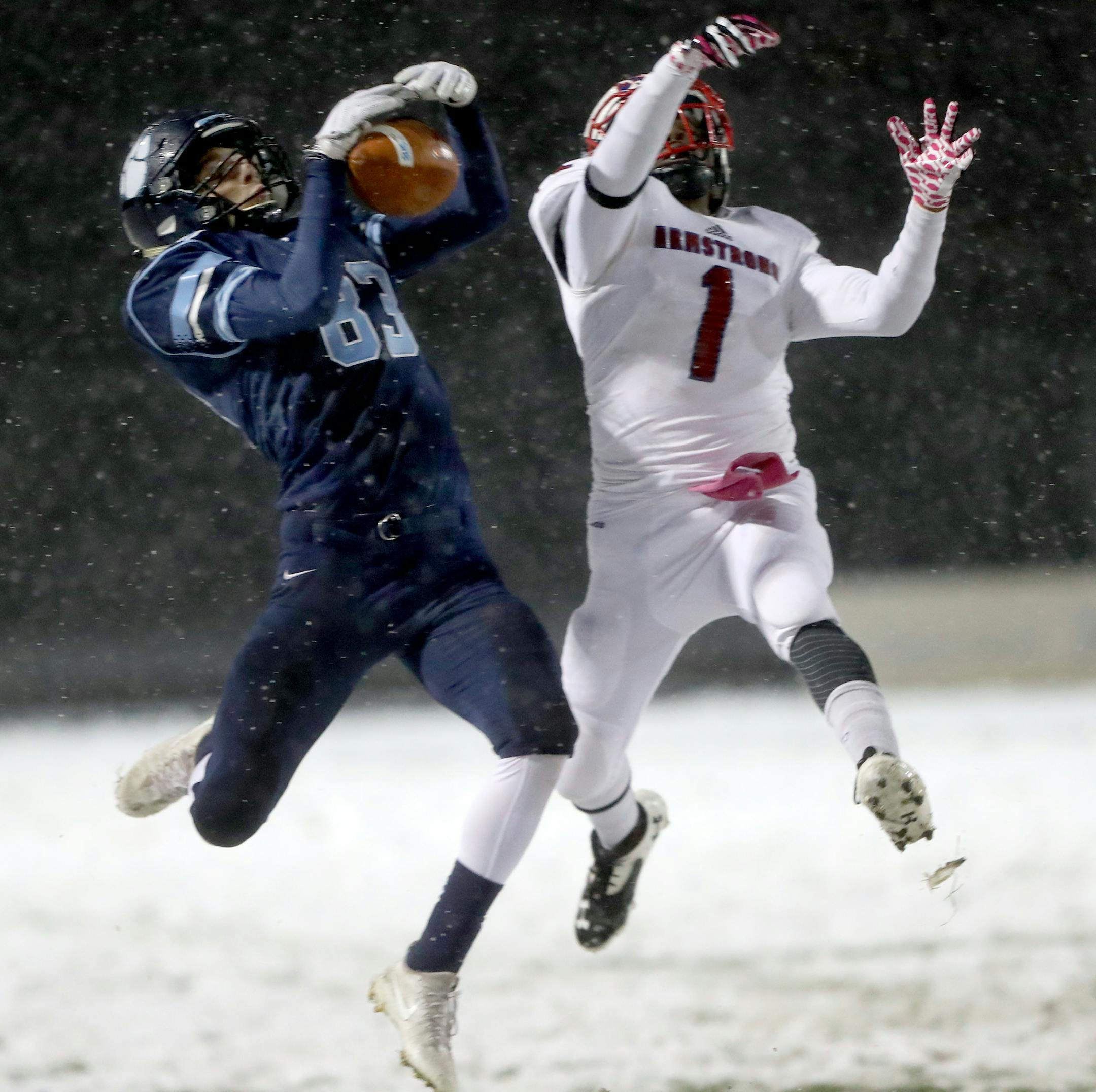Blaine receiver Peyton Downey (83) brings in a long catch against Armstrong defender Maurio Easley (1) during the second quarter of their 6A playoff game Friday, Oct. 27, 2017, at Blaine High in Blaine, MN.] DAVID JOLES ï david.joles@startribune.com 6A football game Armstrong at Blaine,
