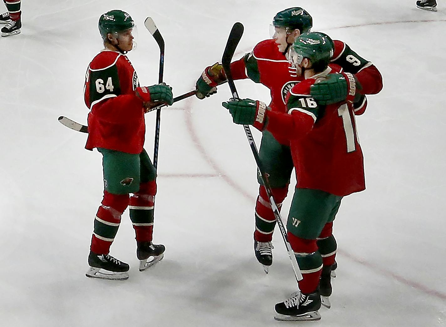 Mikko Koivu (9) celebrated with Jason Zucker (16) and Mikael Granlund (64) after scoring a goal in the third period. ] CARLOS GONZALEZ cgonzalez@startribune.com - December 13, 2016, St. Paul, Minnesota, NHL Hockey, Xcel Energy Center, Minnesota Wild vs. Florida Panthers