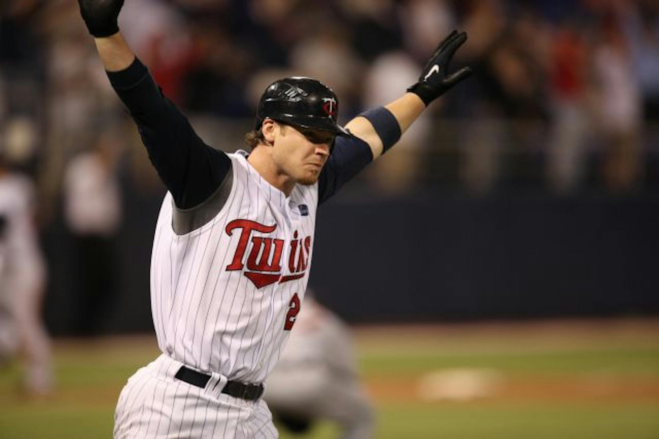 Joe Crede raised his hands as he ran the bases after grand slam to win against the Tigers Wednesday night in the13th inning 14-10.