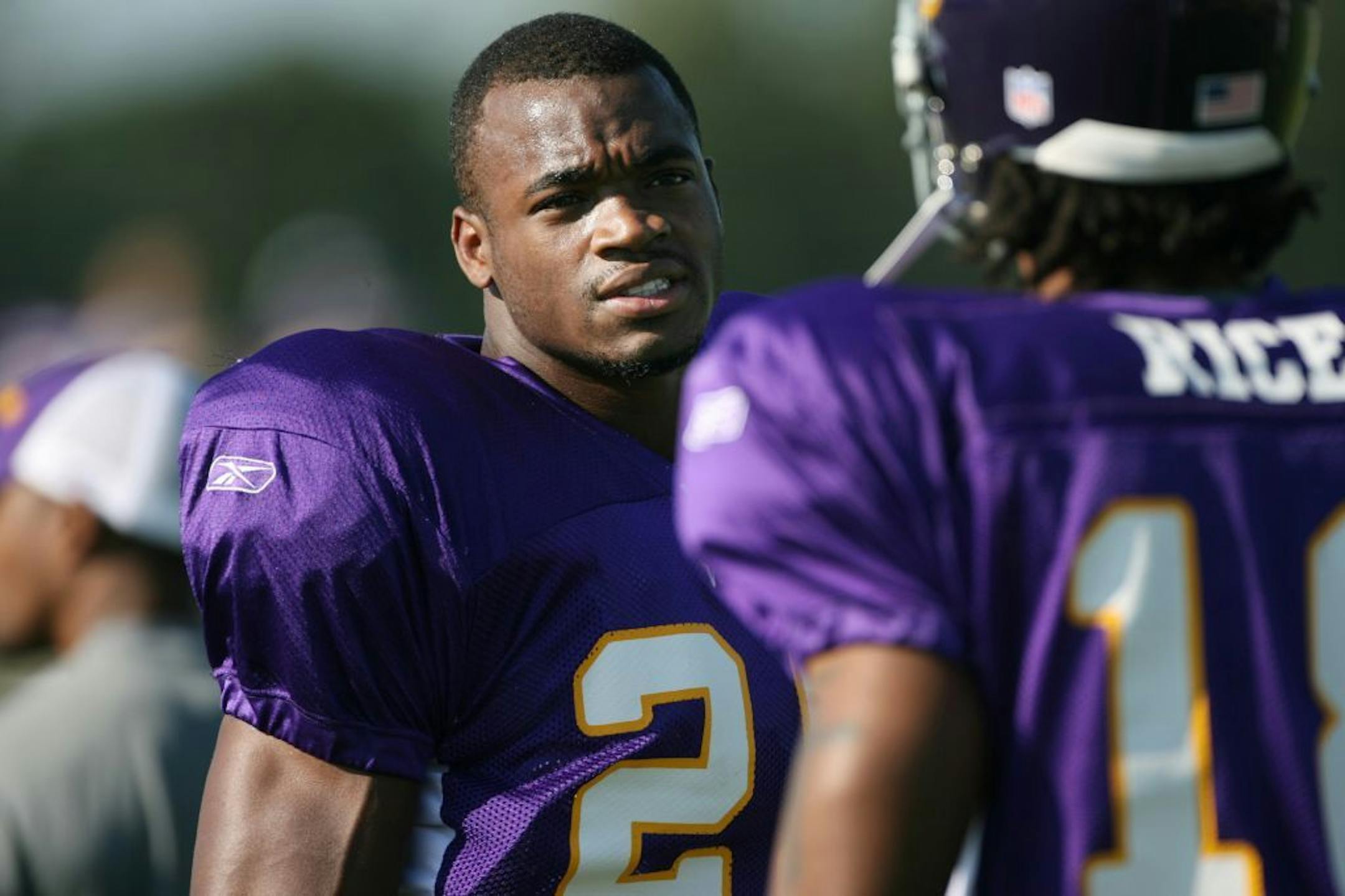 Adrian Peterson, left, and Sidney Rice broke into the NFL together.