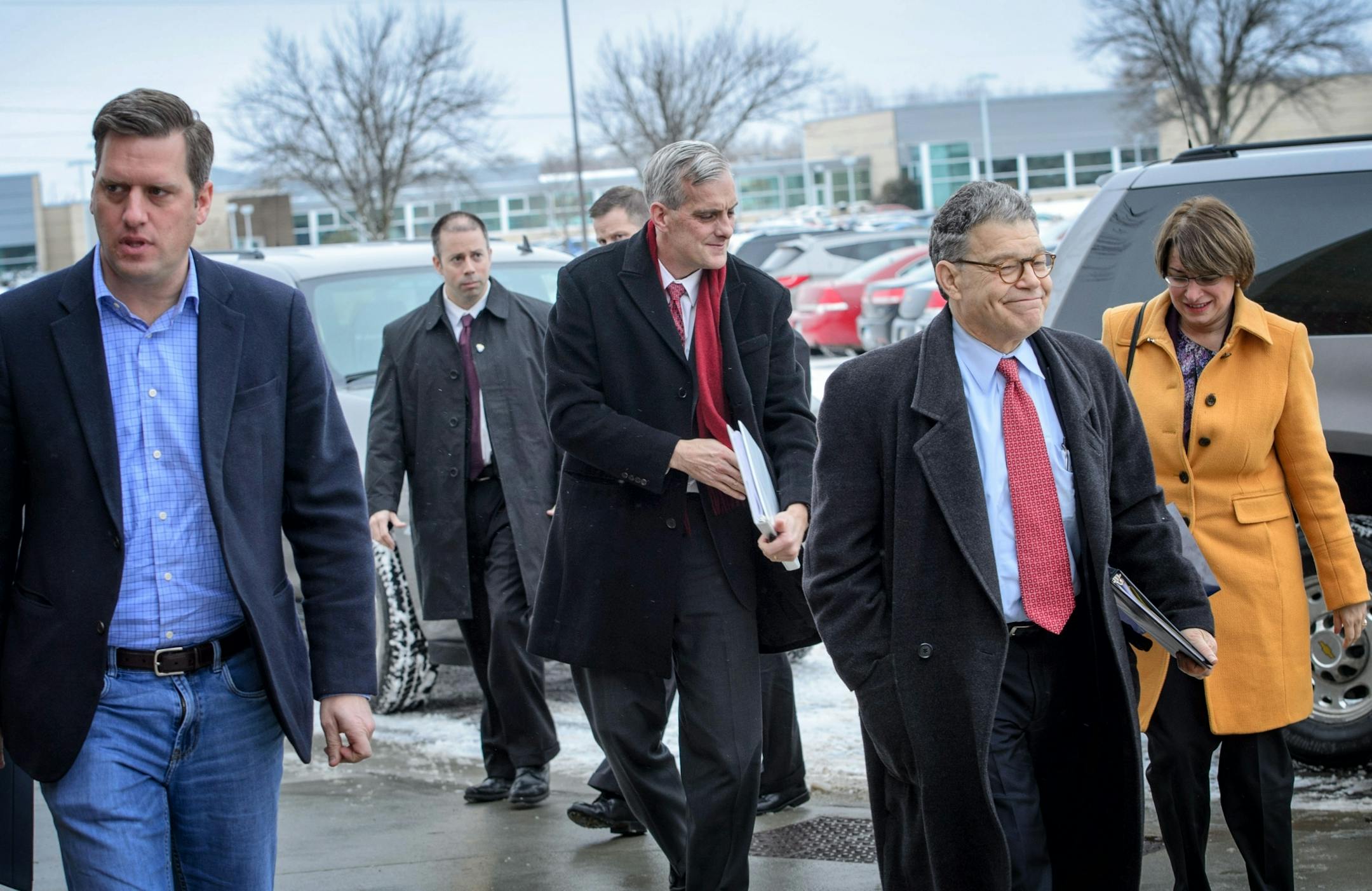 White House chief of staff Denis McDonough, center, arrived in Virginia with Senators Al Franken, Amy Klobuchar and House Speaker Kurt Daudt, left.