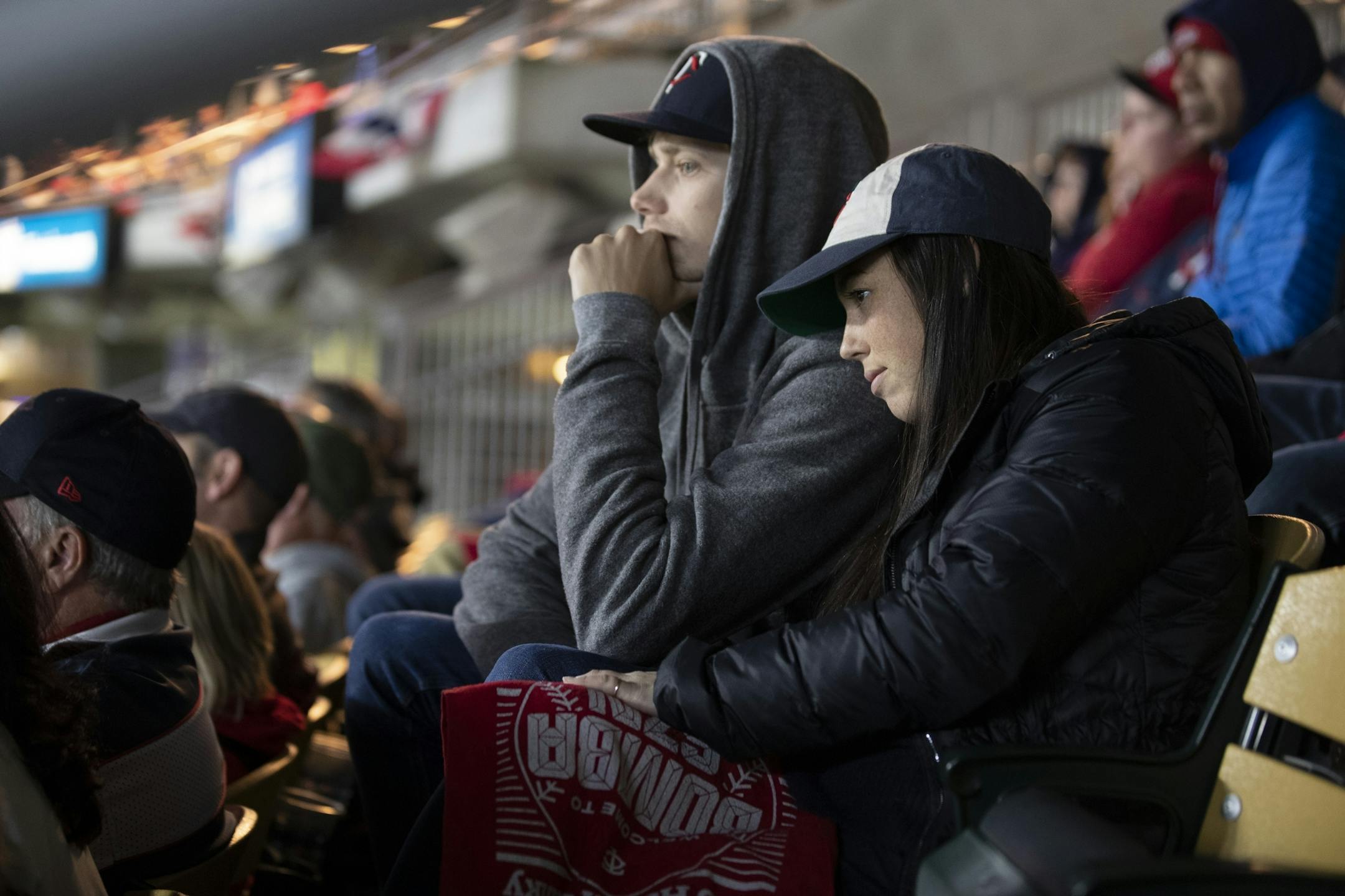 Chris Peterson left and Megan Brown found it hard to watch the Twins in the 8th inning during the third game of the ALDS playoffs at Target Field .