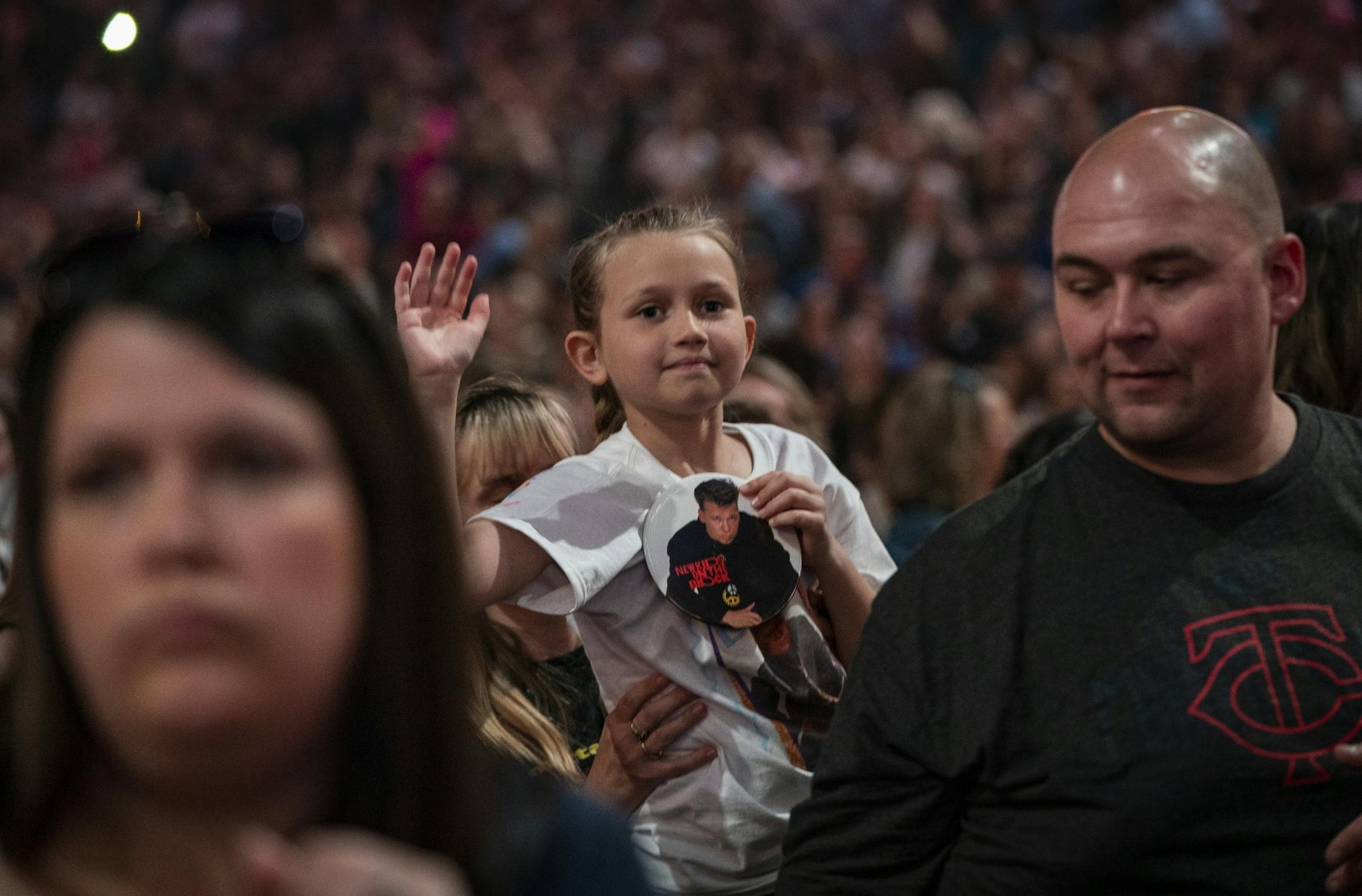 A young fan wears a Donnie Wahlberg button during the New Kids on the Block show at Xcel Energy Center.