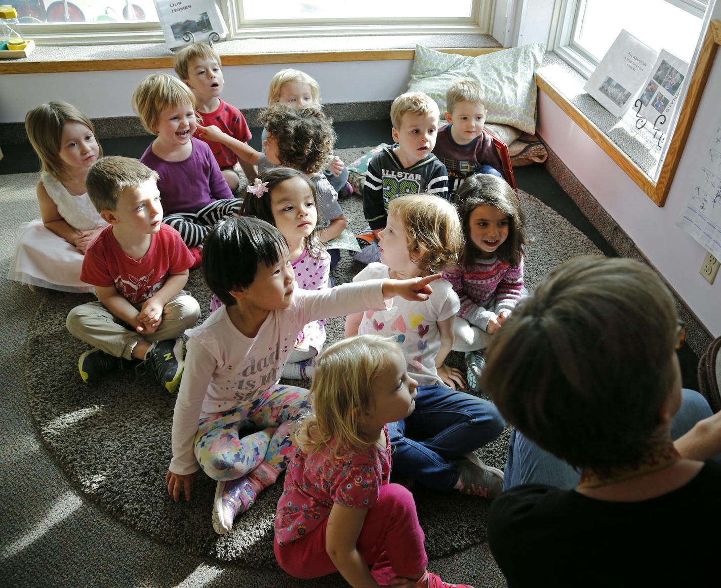 Children gathered and listened as teacher Kelli Kern read a book aloud. Kern, who has worked at the Child Development Center for 30 years, said, "If you want to be in the field, this is the best place to be." ] Shari L. Gross &#xa5; shari.gross@startribune.com Just days after the University of Minnesota announced it would scrap plans to close its child care center after an outcry from parents, families are rallying to oppose a plan to close the Child Development Center. The university wants to o