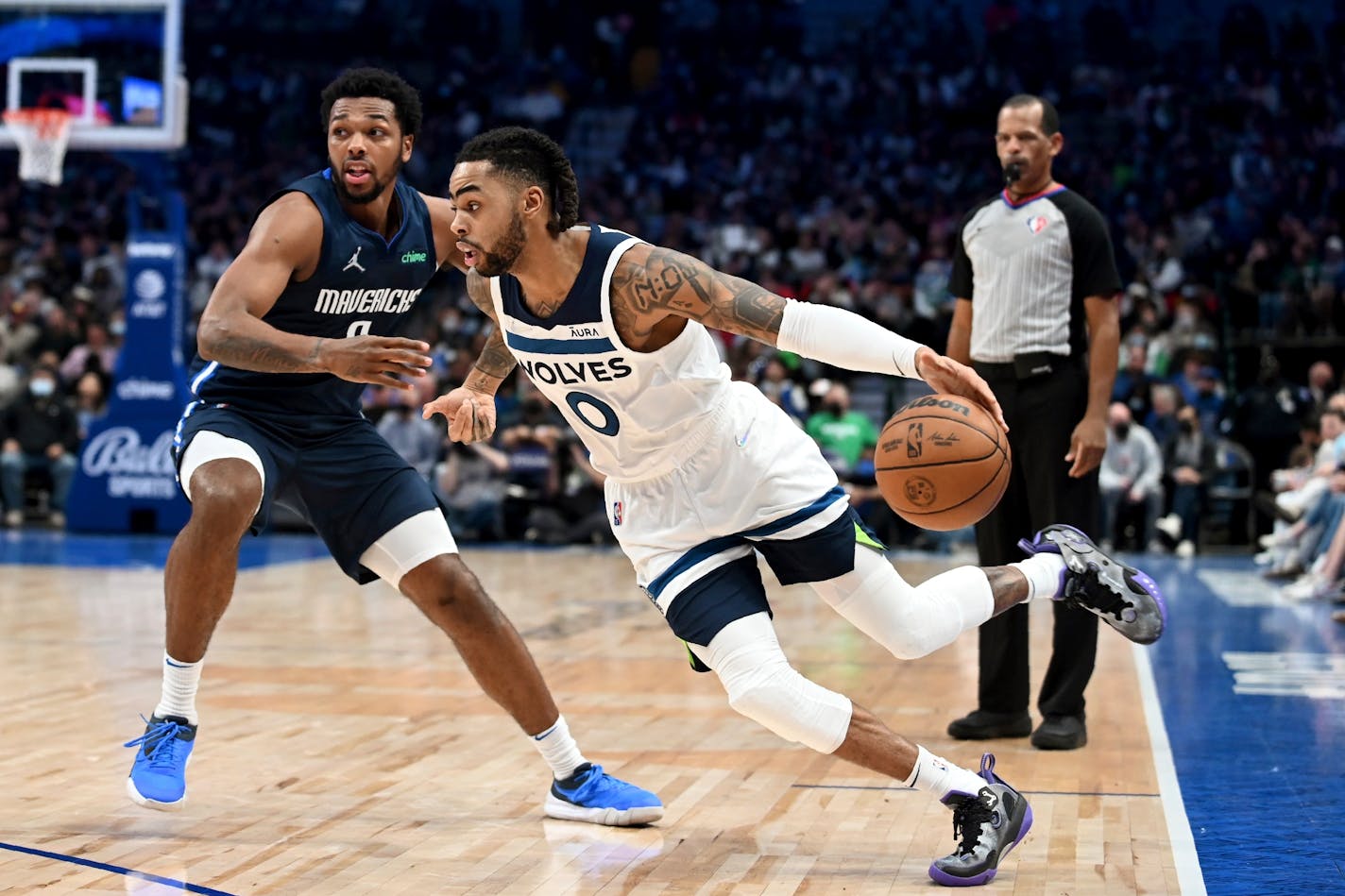 Mavericks forward Sterling Brown defends as Timberwolves guard D'Angelo Russell handles the ball in the second half Tuesday.