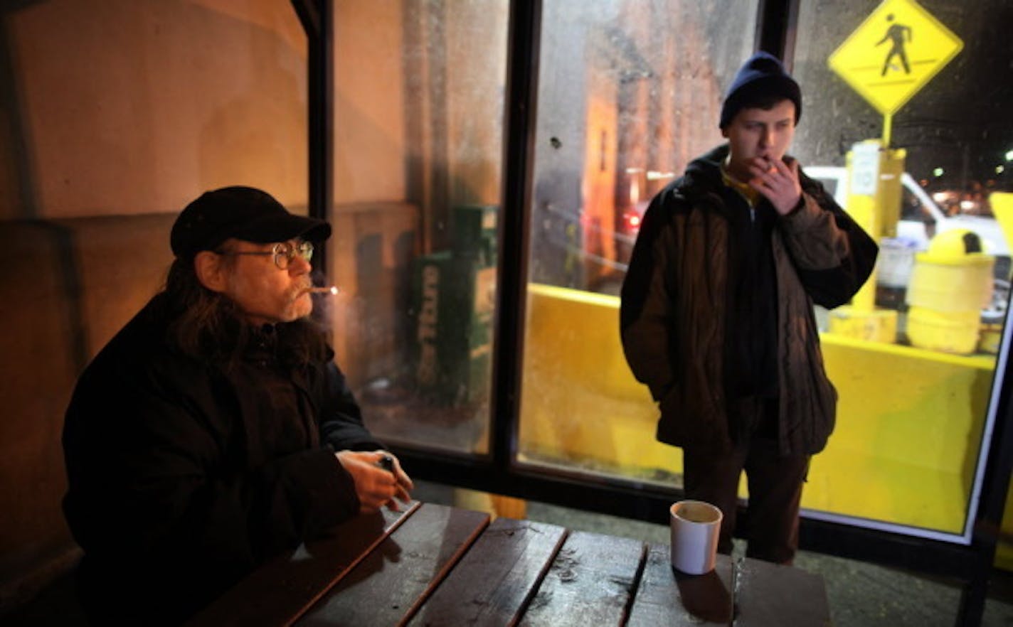 Don Lemmons, 57, and Mark Hanson, 41, enjoy a smoke break at the Ford Plant. PHOTO: Brian Peterson