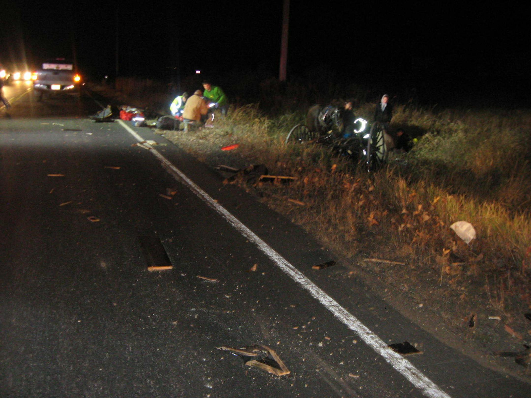 Law enforcement officers investigated the scene near Chetek, Wis., where a semitrailer truck hit a buggy carrying five members of an Amish family.