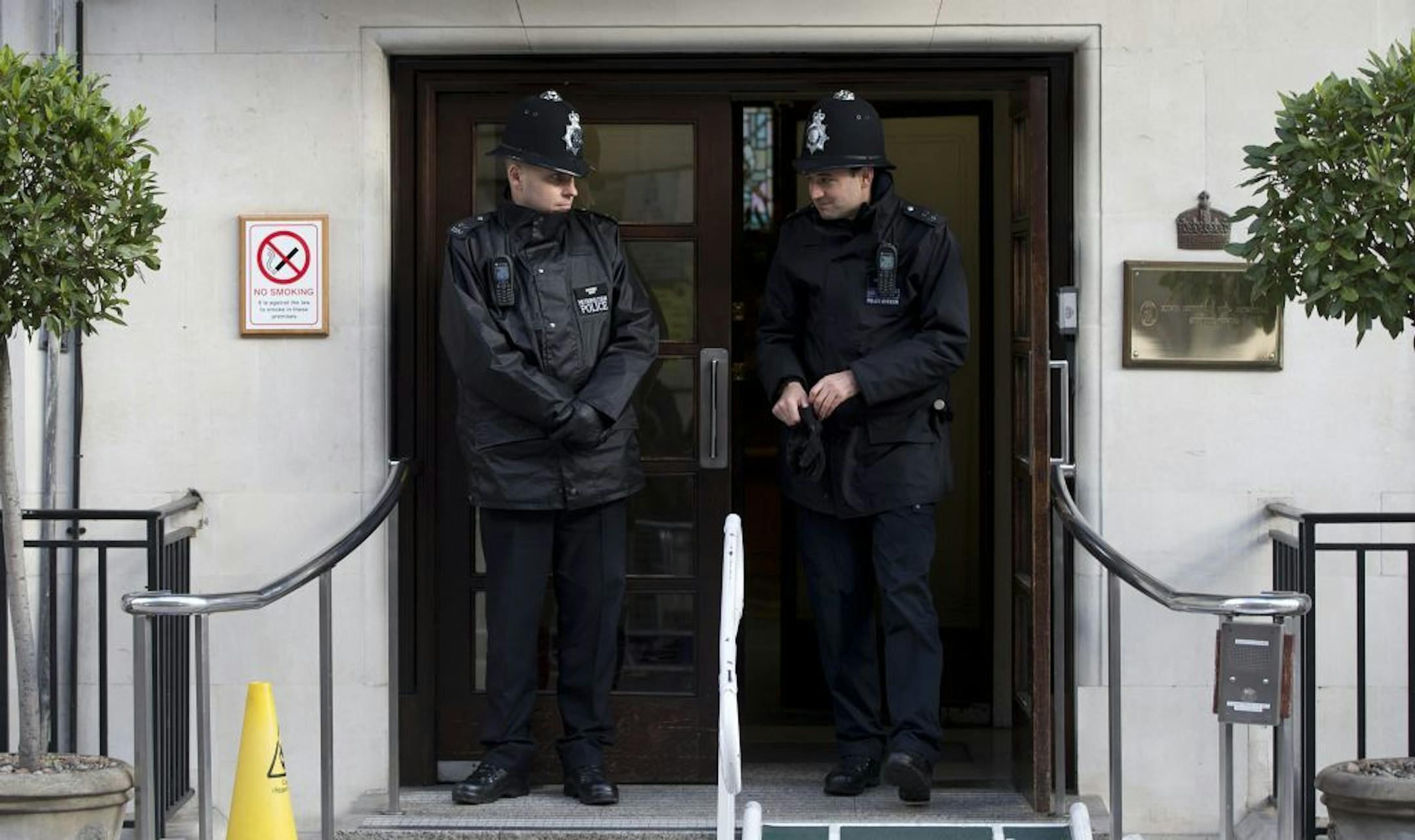 Two policemen stand guard outside the King Edward VII hospital where Kate Duchess of Cambridge received treatment in central London, Wednesday, Dec. 5, 2012. Prince William and his wife Kate are expecting their first child, and the Duchess of Cambridge was admitted to hospital suffering from a severe form of morning sickness in the early stages of her pregnancy.