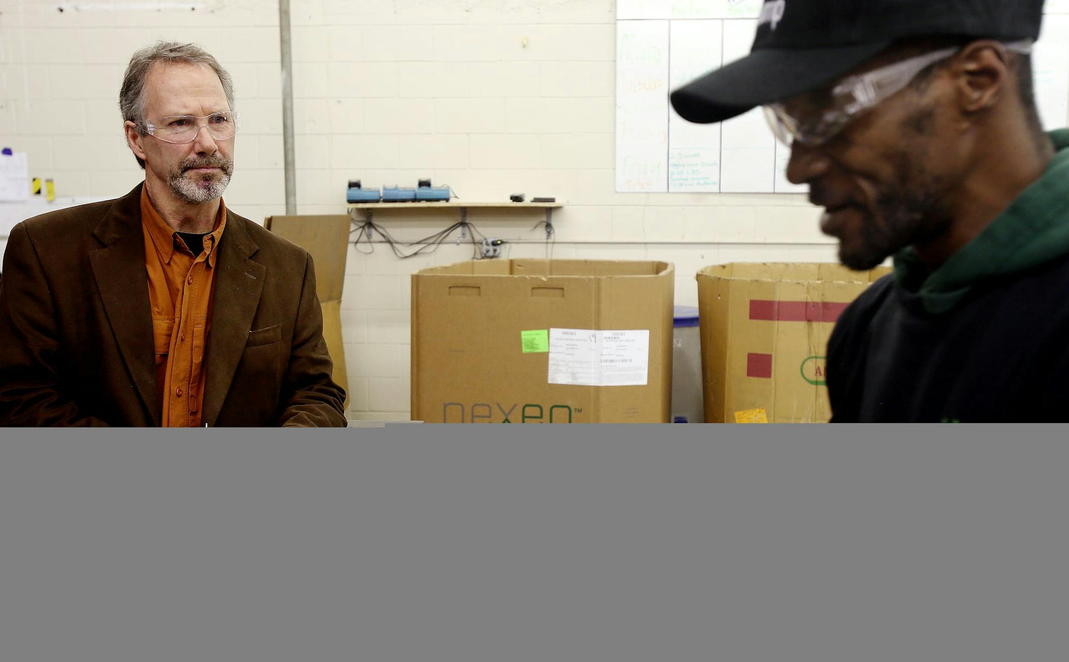 Tech Dump Executive Director Tom McCullough (left) spoke with Ben Johnson about the computer parts he was disassembling at the Tech Dump plant. ] JOELKOYAMA‚Ä¢jkoyama@startribune Golden Valley, MN on February 3, 2014. A couple of successful business guys looking to "give back," are behind a several-year-old nonprofit consumer-electronics recycling service in Golden Valley that expects this year to double the 2 million pounds of product it took in last year and double employment
