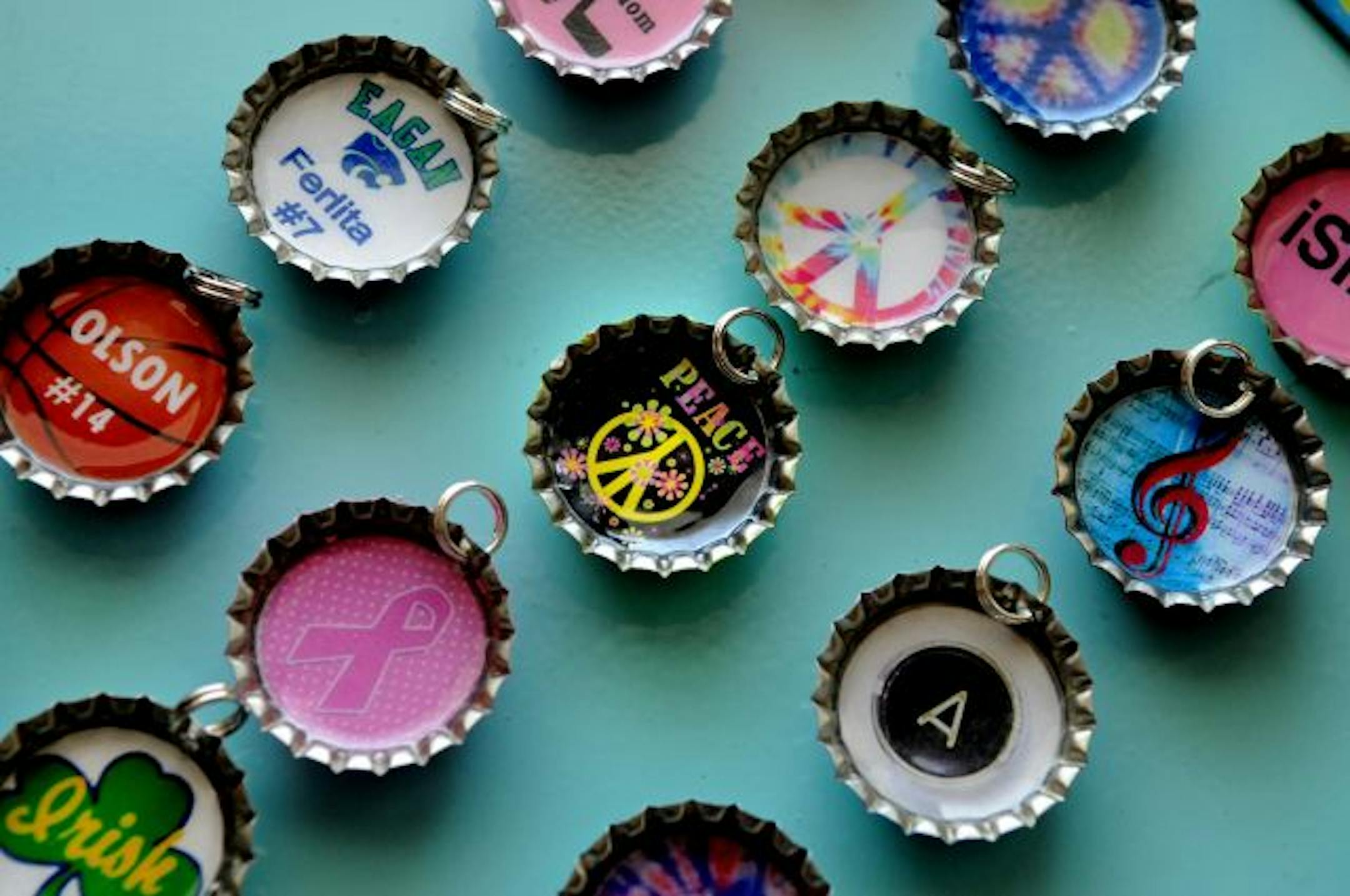 Charms made into bottle caps by Emma Goos and Hannah Olson