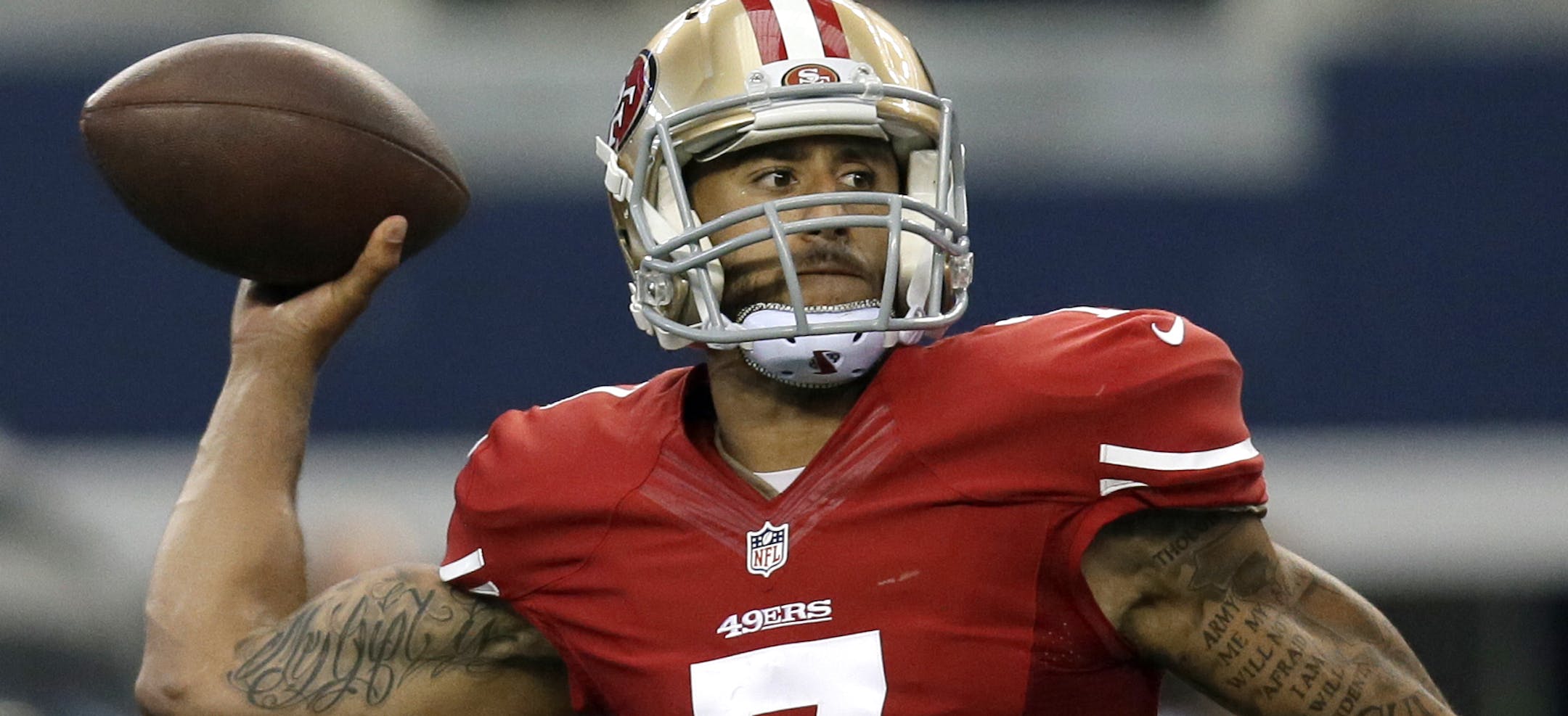 San Francisco 49ers quarterback Colin Kaepernick (7) passes against the Dallas Cowboys during the second half of an NFL football game, Sunday, Sept. 7, 2014, in Arlington, Texas. (AP Photo/Tony Gutierrez)