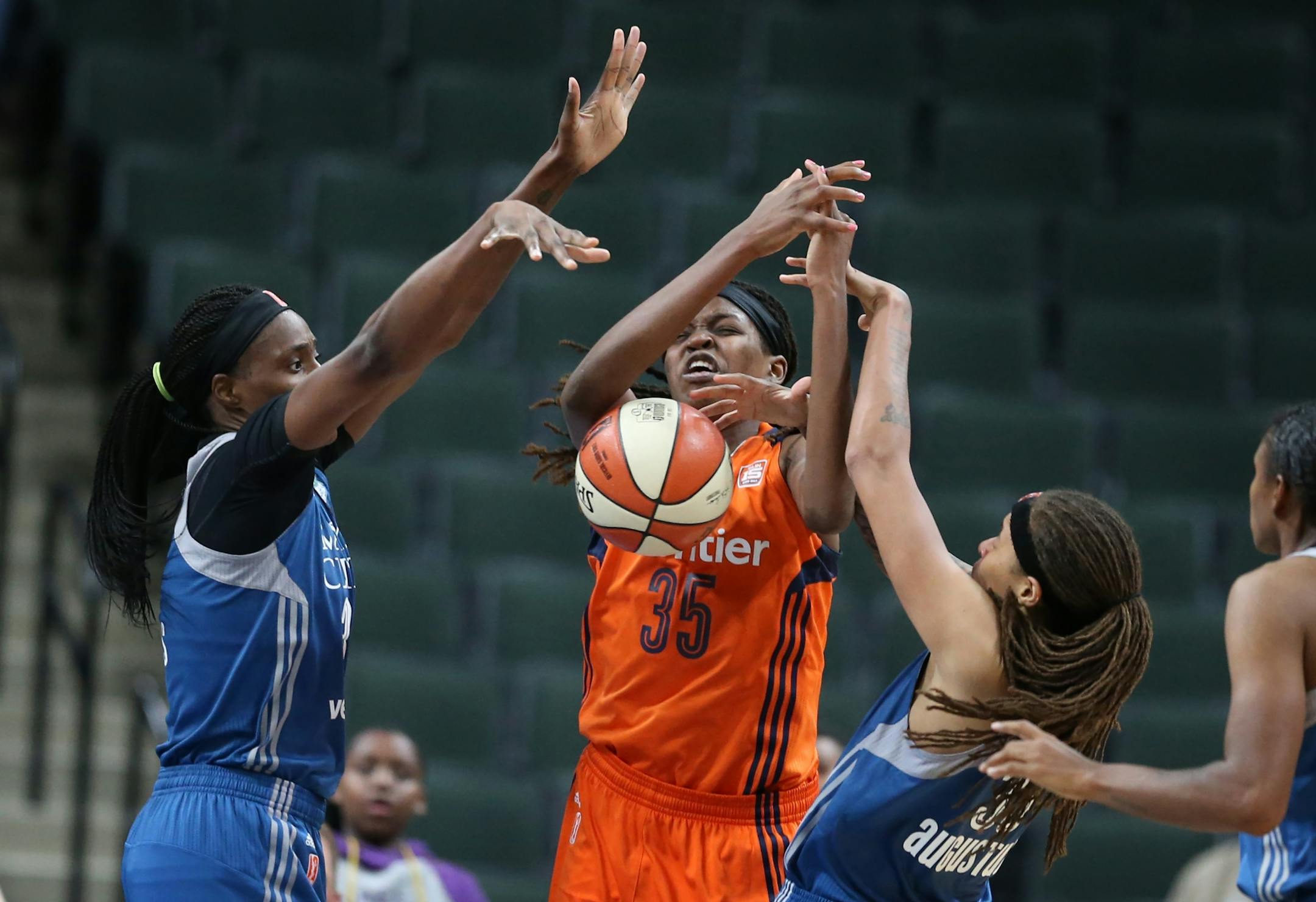 Minnesota Lynx center Sylvia Fowles (34) left and Seimone Augustus (33) forced a jump ball with Connecticut Sun forward Jonquel Jones (35) giving the Lynx and 80-78 win at Xcel Energy Center May 22, 2017 in St. Paul, MN.