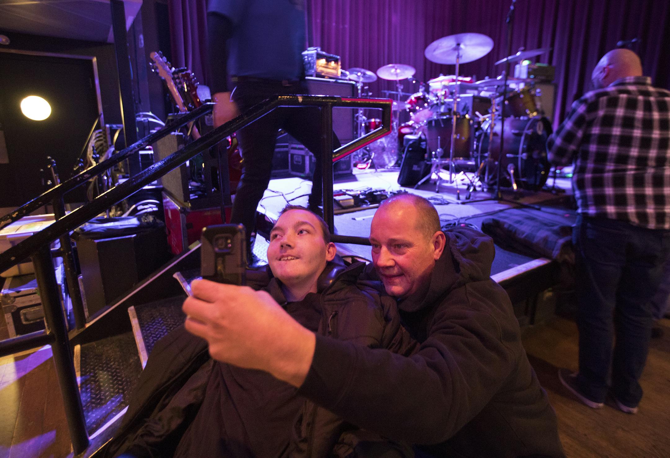 Richard and Mason McDeid took a selfie before the Helmet concert. After the show, the band&#x2019;s guitarist gave Mason a set list and pick, adding to his souvenirs. "We're definitely rock guys," Richard said.