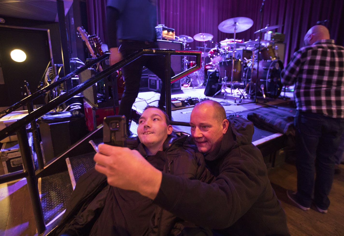 Richard and Mason McDeid took a selfie before the Helmet concert. After the show, the band&#x2019;s guitarist gave Mason a set list and pick, adding to his souvenirs. "We're definitely rock guys," Richard said.