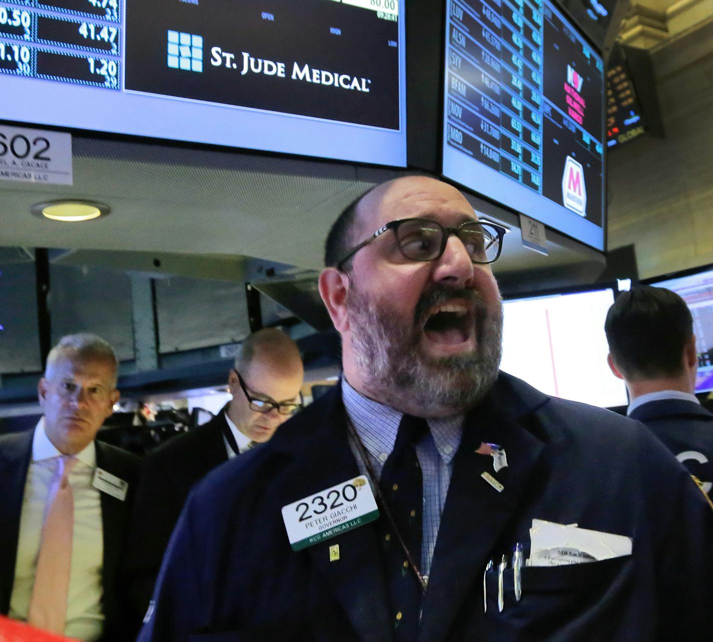 Specialist Peter Giacchi calls out prices for St. Jude Medical on the floor of the New York Stock Exchange, Thursday, April 28, 2016. Abbott Laboratories will spend $19.3 billion to buy St. Jude Medical Inc. in a cash-stock deal that aims to strengthen the medical device maker's stake in cardiovascular care. (AP Photo/Richard Drew)