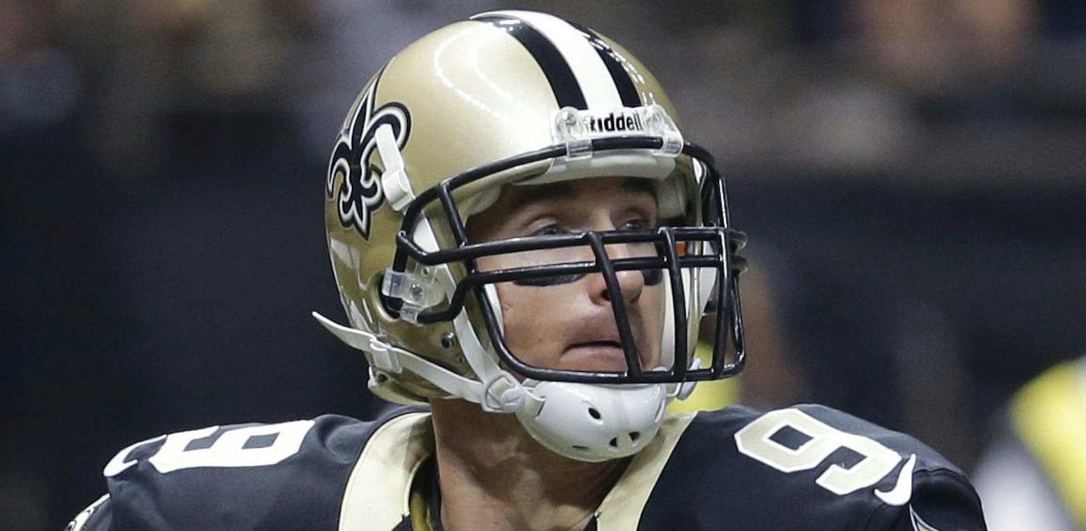 New Orleans Saints quarterback Drew Brees (9) passes from the end zone in the first half of an NFL football game against the San Francisco 49ers in New Orleans, Sunday, Nov. 17, 2013. (AP Photo/Bill Haber)