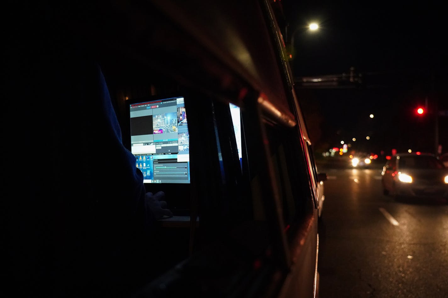 The video switcher and livestream screen for the "Bands on Vans" concert with Nur-D and DJ Hayes was seen through the vehicle window during a stop outside the 311 Club.