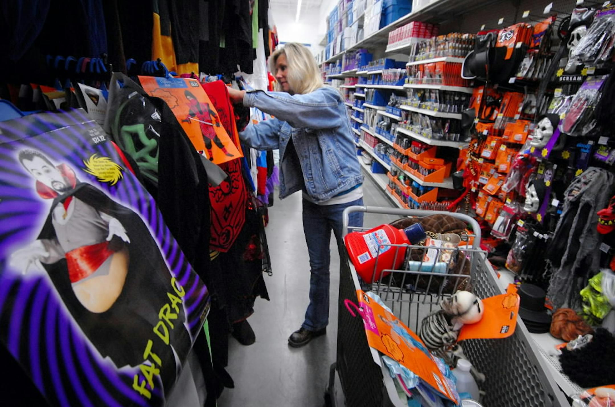GLEN STUBBE • gstubbe@startribune.com Tuesday, October 17, 2006 -- Eagan, Minn. -- Mary Seidel of Eagan shopped the Halloween section of the Eagan Walmart. She was looking for costumes for her 6-year-old's birthday party that falls near Halloween and will have a Halloween theme. Parents looking to save money can register for Eagan's Halloween costume swap.