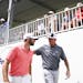 Tom Lehman put his arms around Matthew Wolff as the two walked back toward the clubhouse after finishing the third round of the 3M Open Saturday. ] Aa