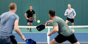 Eric Theriault, left, RJ Singh, Freddy Akradi and Aleks Westlund play a match at Life Time Chanhassen Pickleball in April. The facility next to the co