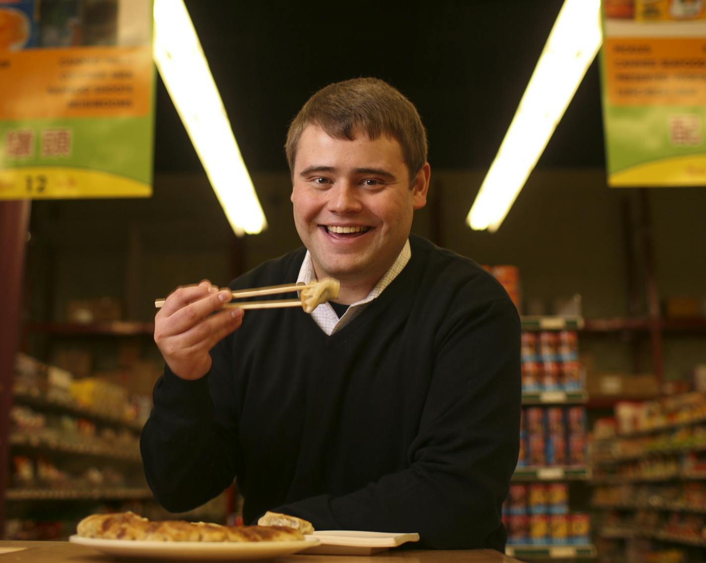 Steve Whitten, Chief of Operations at United Noodles, eating some Chinese potstickers cooked up by Alice Fung Wednesday afternoon. ] JEFF WHEELER &#x201a;&#xc4;&#xa2; jeff.wheeler@startribune.com The Lunar New Year is many things, depending on the culture, the region and a family's traditions. The folks at United Noodles walk us through what's traditional and what's trendy, with accompanying recipes. Alice Fung cooked up a couple of dishes in the kitchen at United Noodles in Minneapolis, Wednesd