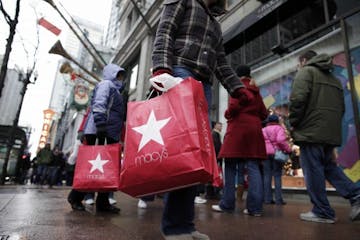 In this photo made Dec. 19, 2009, shoppers walk outside Macy's along State Street in Chicago. Retailers head into the home stretch this week hoping pe