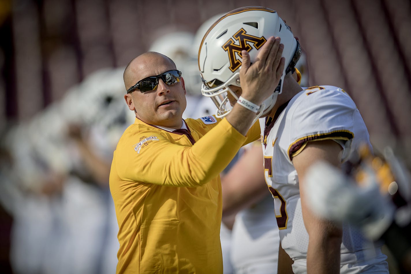 Minnesota's Head Coach P. J. Fleck greeted players on the field including quarterback Zack Annexstad as they warmed up before Minnesota took on New Mexico State at TCF Bank Stadium, Thursday, August 30, 2018 in Minneapolis, MN. ] ELIZABETH FLORES &#x2022; liz.flores@startribune.com