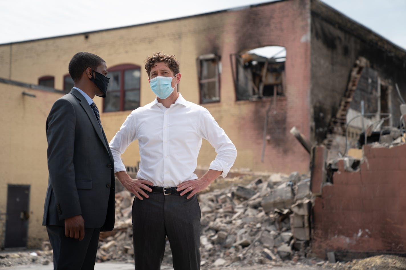 Minneapolis Mayor Jacob Frey and St. Paul Mayor Melvin Carter talked after the press conference. In the Lake Street parking lot with the burned out Foot locker store behind them, and next to the Midtown Global Market, State legislators who represent the most impacted areas from civil unrest announced the PROMISE Act -- a comprehensive plan to help businesses rebuild and recover, many of which are Black, immigrant, and communities of color-owned. ] GLEN STUBBE • glen.stubbe@startribune.com Monday