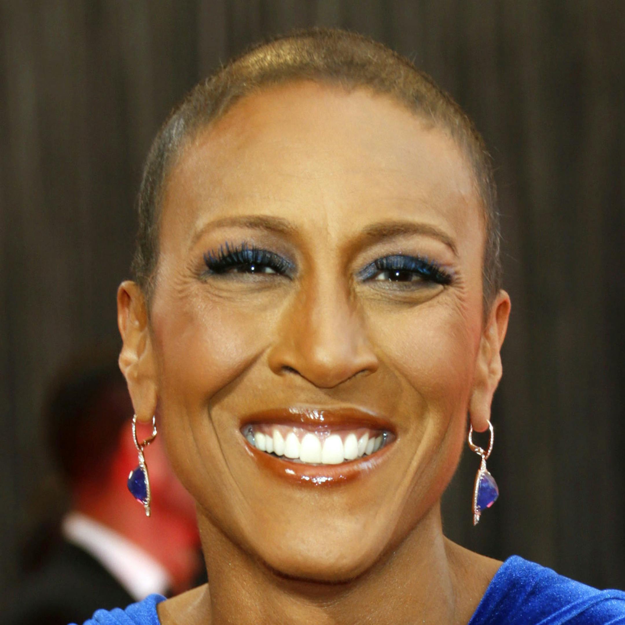File-This Feb. 24, 2013 file photo shows broadcaster Robin Roberts arriving at the 85th Academy Awards at the Dolby Theatre in Los Angeles. Roberts thanked her longtime girlfriend, Amber Laign, in a year-end post published on the ABC News anchorís Facebook page on Sunday, Dec. 29, 2013. The message comes after Robertsí battle with a life-threatening illness. This is the first time the ìGood Morning Americaî anchor has publicly acknowledged her 10-year, same-sex relationship w