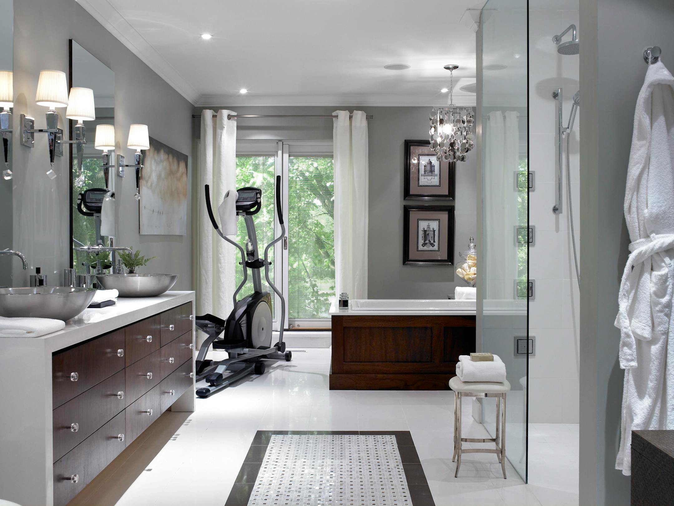 By using masculine finishes, modern fixtures and space-saving techniques, this bathroom got a men's-club-inspired makeover that blends serenity with functionality. It's a striking bathroom and workout space.