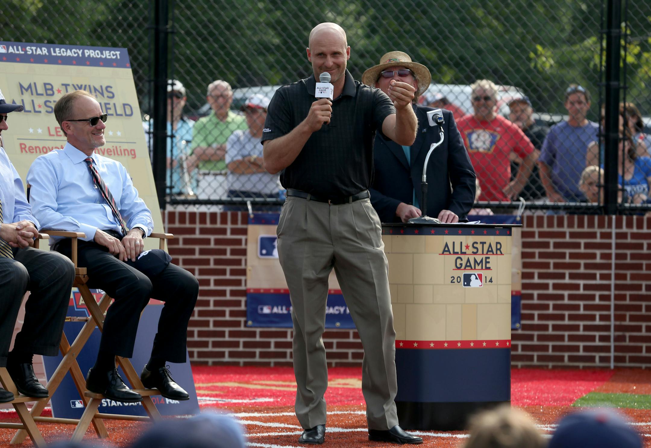 Former Twin Corey Koskie talked to the little leaguers about making sure that they closed their moths sliding into bases because the rubber doesn't taste good during the dedication ceremony. ] (KYNDELL HARKNESS/STAR TRIBUNE) kyndell.harkness@startribune.com At Lee Field in St. Paul, Min. Thursday, July 9, 2014. A baseball field in Robbinsdale has gotten a big upgrade, with a large part of the funding coming from Major League Baseball in conjunction with the All Star game.