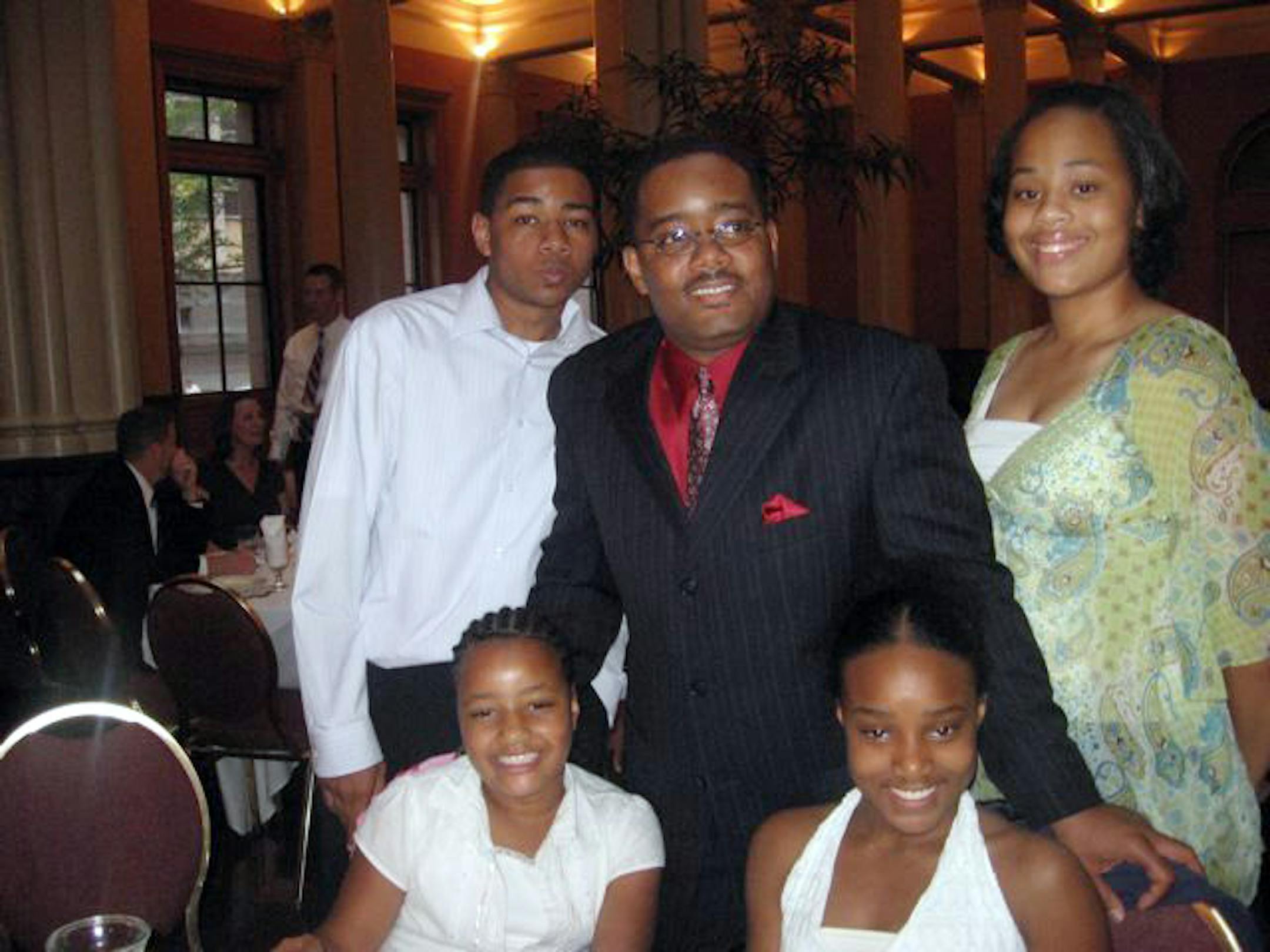 After his wife died, Bernard Gill, center, raised his four children until his untimely death this spring. Geoffrey, 20, is keeping the family together, but "it gets to be a lot sometimes," he said.