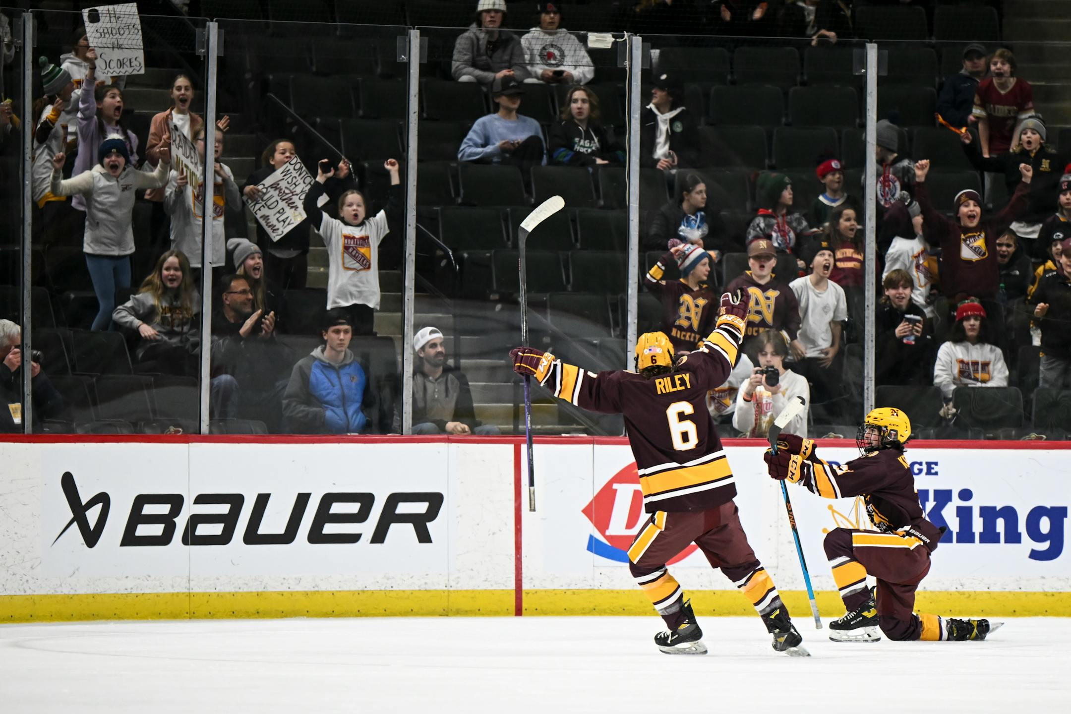 Northfield defenseman Brecken Riley (6) and forward Griffin Kennelly (21) celebrate Kennelly's goal against Orono during the second period.