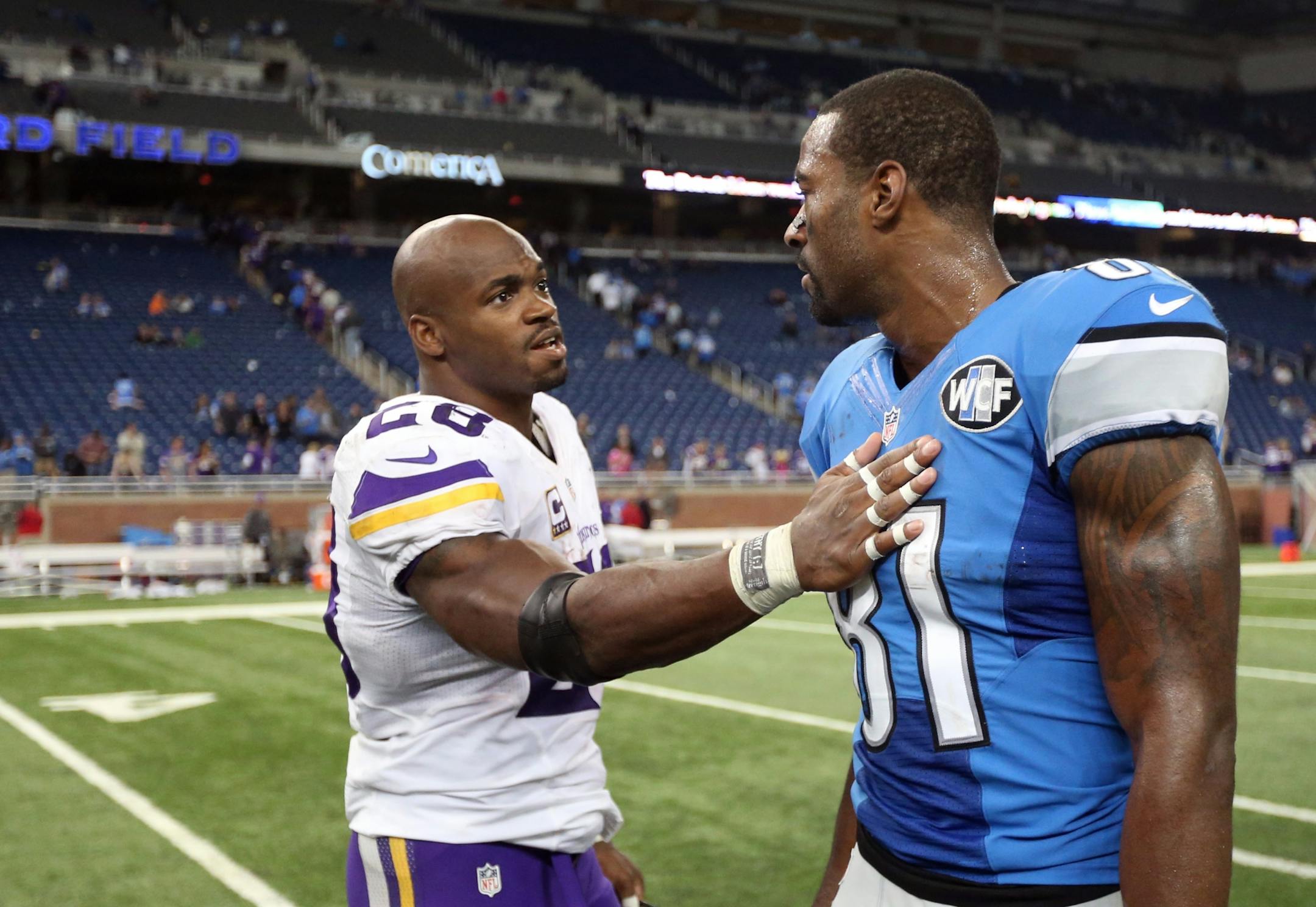 Minnesota Vikings running back Adrian Peterson (28) talked with Detroit Lions wide receiver Calvin Johnson (81) after the game at Ford Field Sunday October 25, 2015 in Detroit, MI.