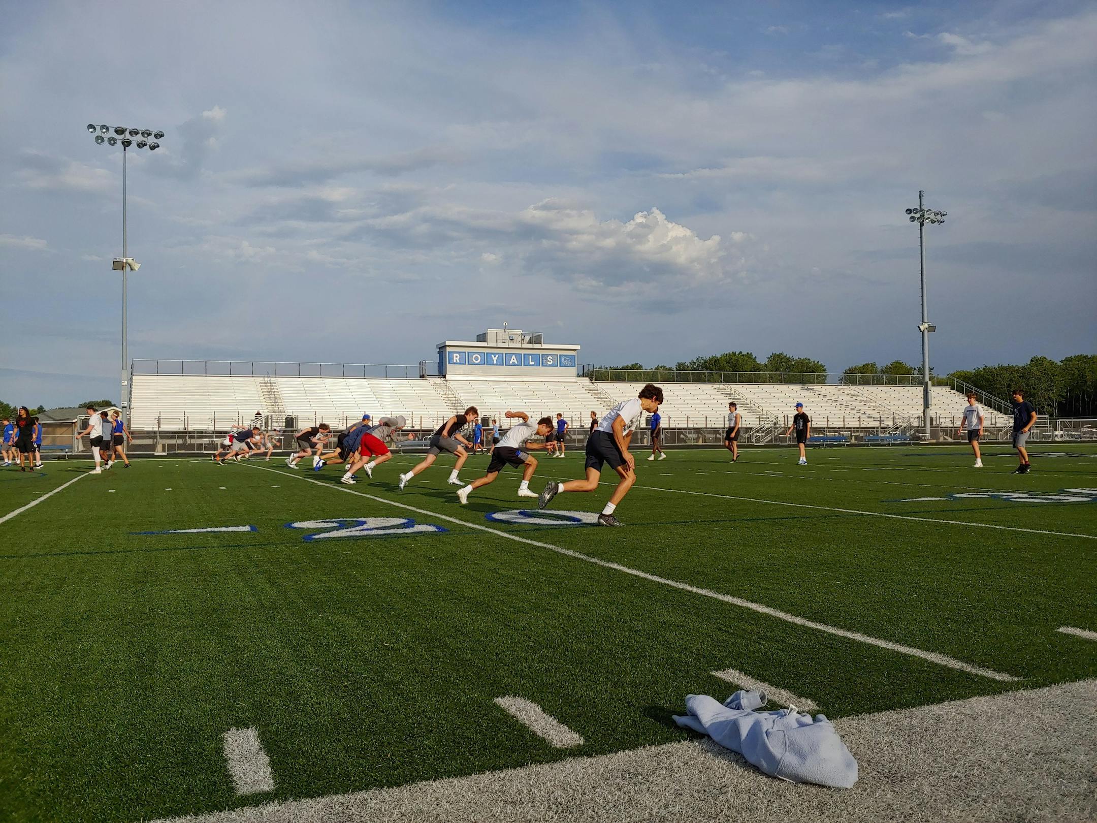 Woodbury football players took part in the first summer workout allowed with coaches on Monday. "It's a way different atmosphere when you're working with your teammates," football player Jake Raines said.