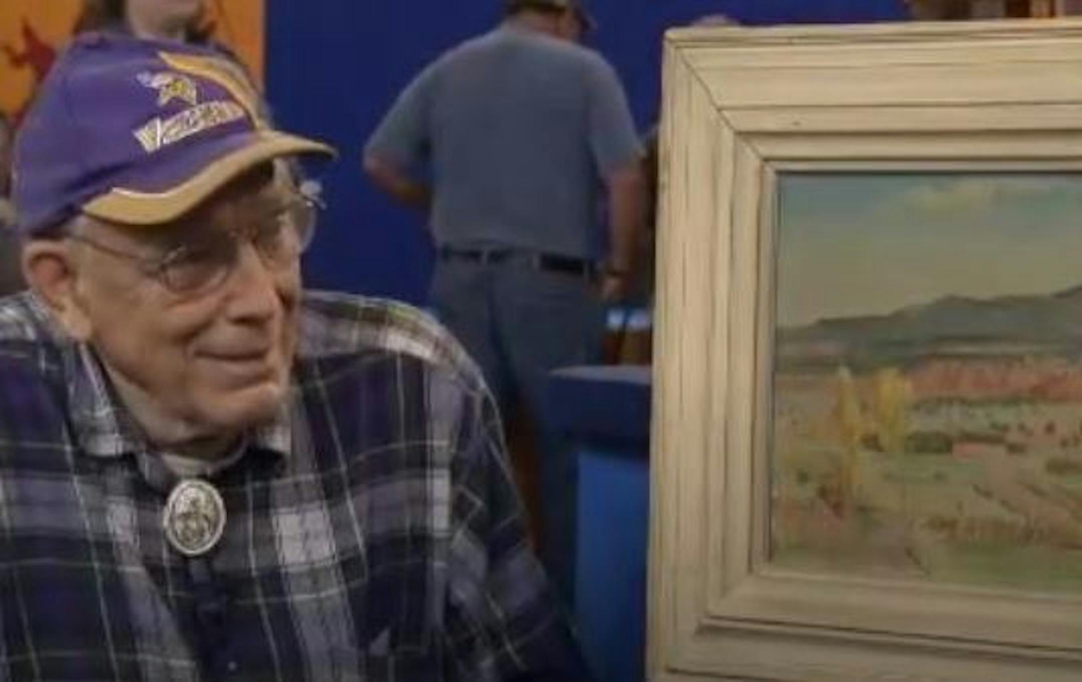 Donald Bridell was quite pleased to hear while on “Antiques Roadshow” years ago that the painting at his side was worth at least $75,000. Credit: From “Antiques Roadshow,” provided by WGBH Television