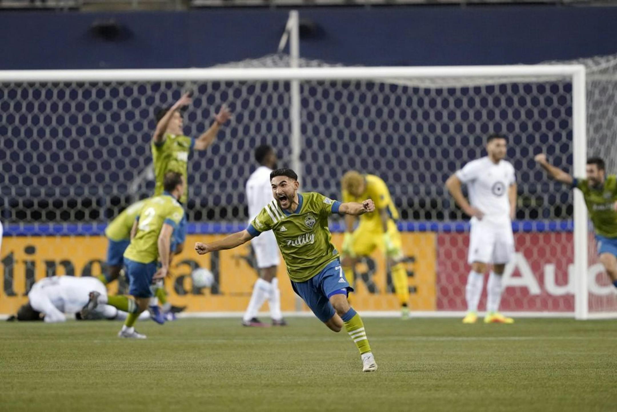 Seattle Sounders' Cristian Roldan (7) celebrates a Sounders goal late in the second half of an MLS playoff Western Conference final soccer match against Minnesota United, Monday, Dec. 7, 2020, in Seattle. The Sounders won 3-2.