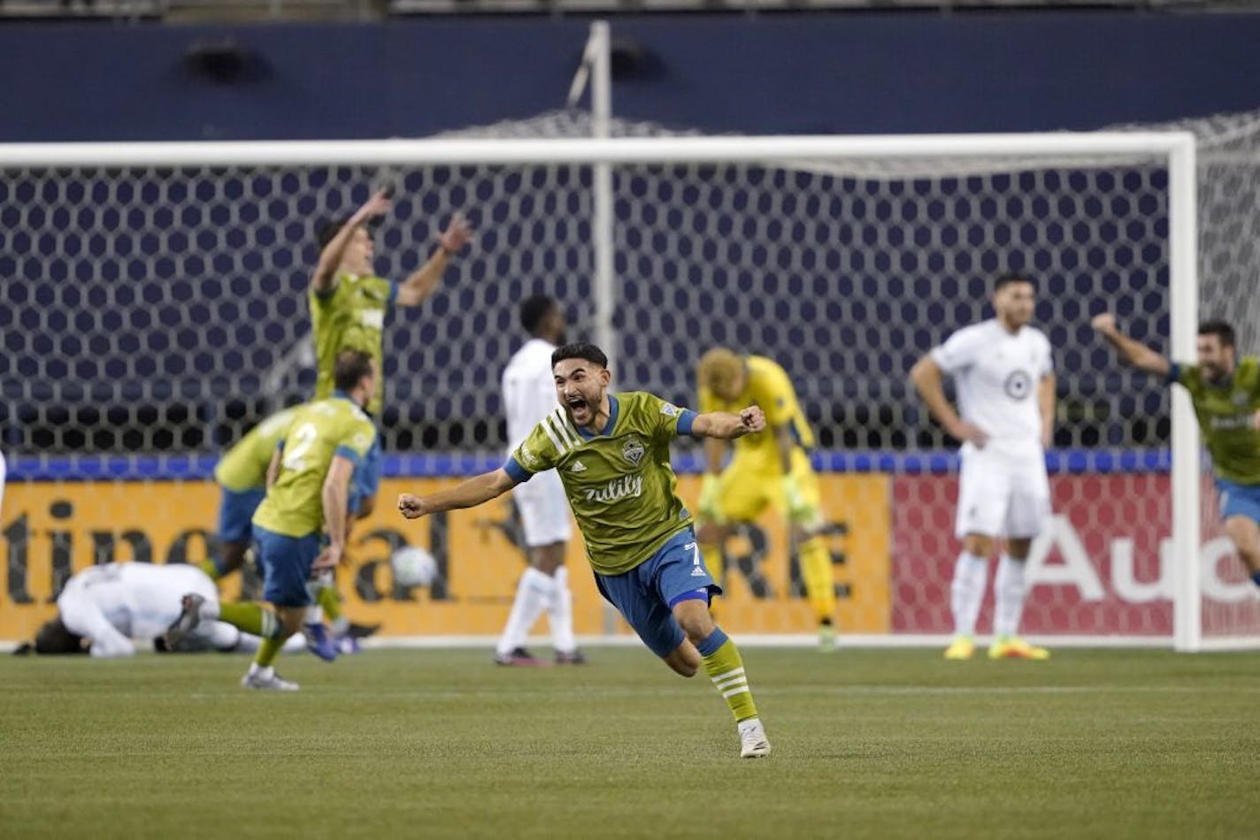 Seattle Sounders' Cristian Roldan (7) celebrates a Sounders goal late in the second half of an MLS playoff Western Conference final soccer match against Minnesota United, Monday, Dec. 7, 2020, in Seattle. The Sounders won 3-2.