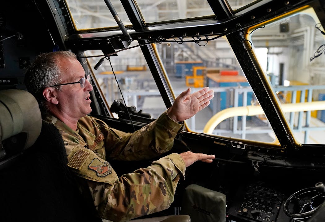 On 9/11, Senior Master Sergeant Corey Berg was on a C-130 H leaving Andrew Air Force Base that watched as the jet hit the Pentagon - then not long after was flying over Pennsylvania and saw the jet crash into fields there. Here, Senior Master Sergeant Corey Berg of the Minnesota Air National Guard posed in the cockpit of the C-130 H plane he was a crew member of on 9/11 and seen at  the 133rd Airlift Wing Wednesday in St. Paul.
