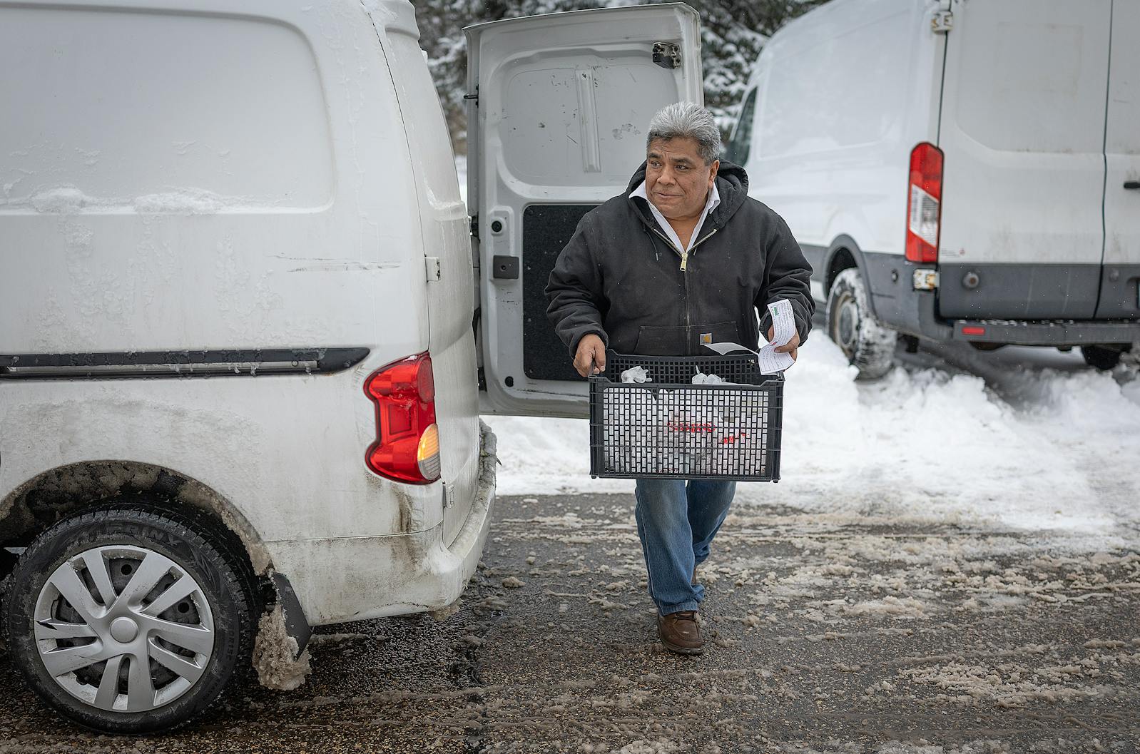 Ramiro Hernandez, the owner of Bymore Supermercado, makes a free delivery of groceries to a family in St. Paul on Wednesday.  As threats of ICE action swirl around the Twin Cities, members of the Latino and other minority communities are increasingly afraid to run basic errands.