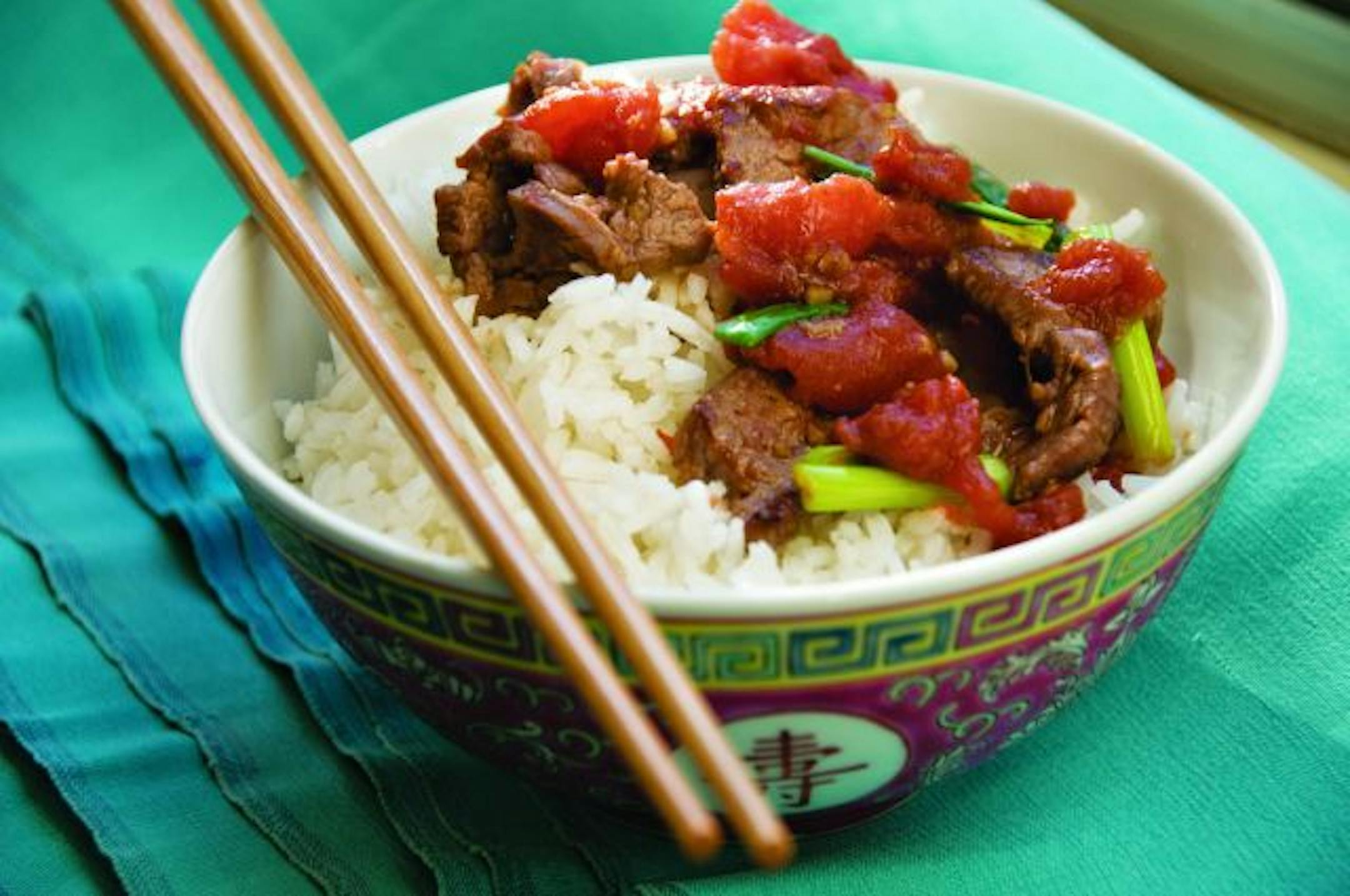 Stir-fried ginger tomato beef makes use of canned tomatoes when fresh aren't flavorful.