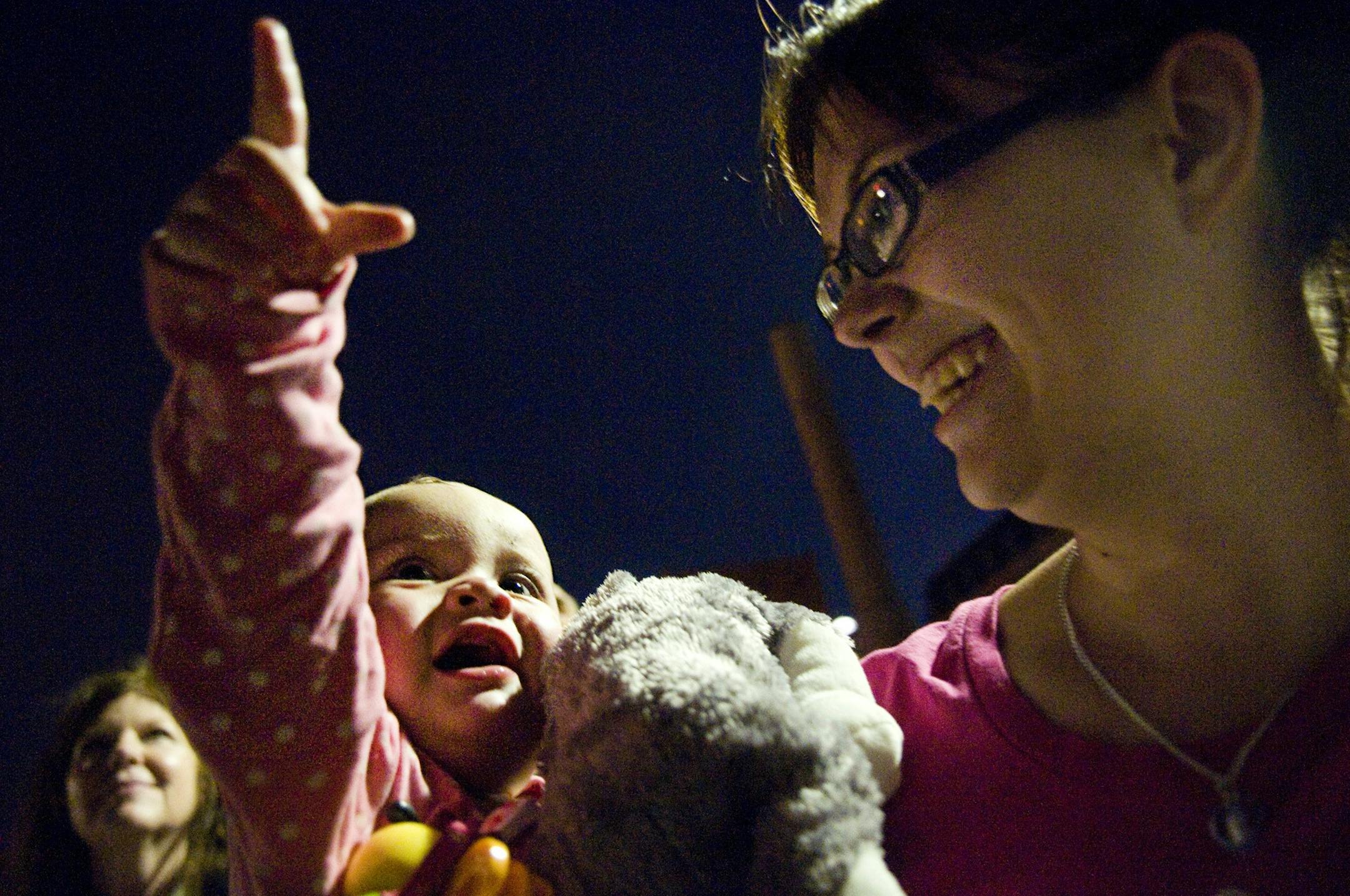 Last Fourth of July Skyler Ingram of Minneapolis was sitting on a boat in Marshall, Minn. 8-months pregnant watching fireworks when instantly she decided what she was going to name her baby girl. "During the first 8-months of my pregnancy, we were going to name her something else, but when I was on the boat that night I said, were going to name her Alexis," said Ingram. A year later 19-year-old mother, Skyler Ingram holds 11-month old Alexis Ingram on the Stone Arch Bridge as she watches firewor