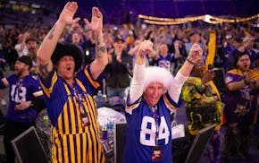 Tim and Theresa Ogren reacted to the Vikings choosing Michigan quarterback J.J. McCarthy at an NFL draft party April 25, 2024, at U.S. Bank Stadium in