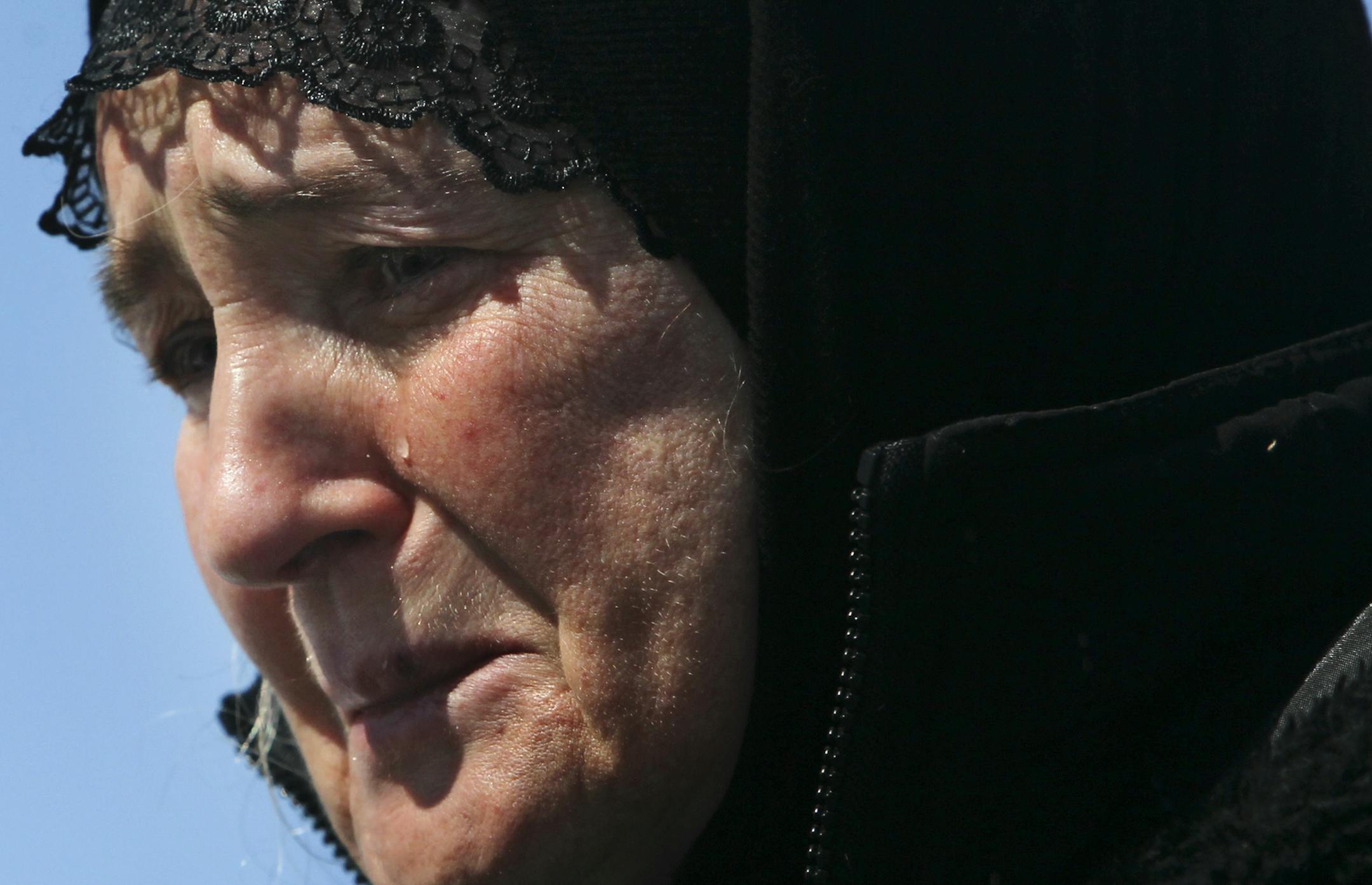 Russian immigrant Tamara Oulanova of Minneapolis spent $13,000 and 10 years to exhume her son's body from a Russian grave and bring him here in the U.S. in order to be close to him. Here, Oulanova, 56, became emotional while singing a Russian hymn during the burial for her son Alexey Tuesday, March 19, 2013, in St. Mary's Orthodox Cathedral Cemetery in St. Anthony, MN. Alexey, 26, had been beaten by thugs back in Russian in 2000, and died of his injuries in 2003.] (DAVID JOLES/STARTRIBUNE) djole
