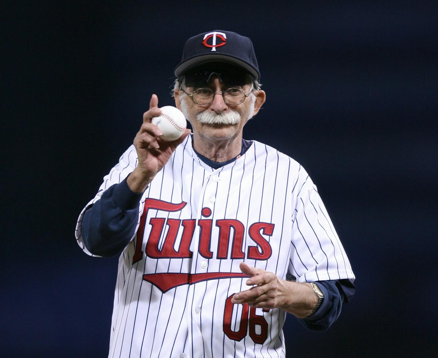 Twins clubhouse fixture Wayne "Big Fella" Hattaway was honored before a game in 2006 by throwing out the ceremonial first pitch.