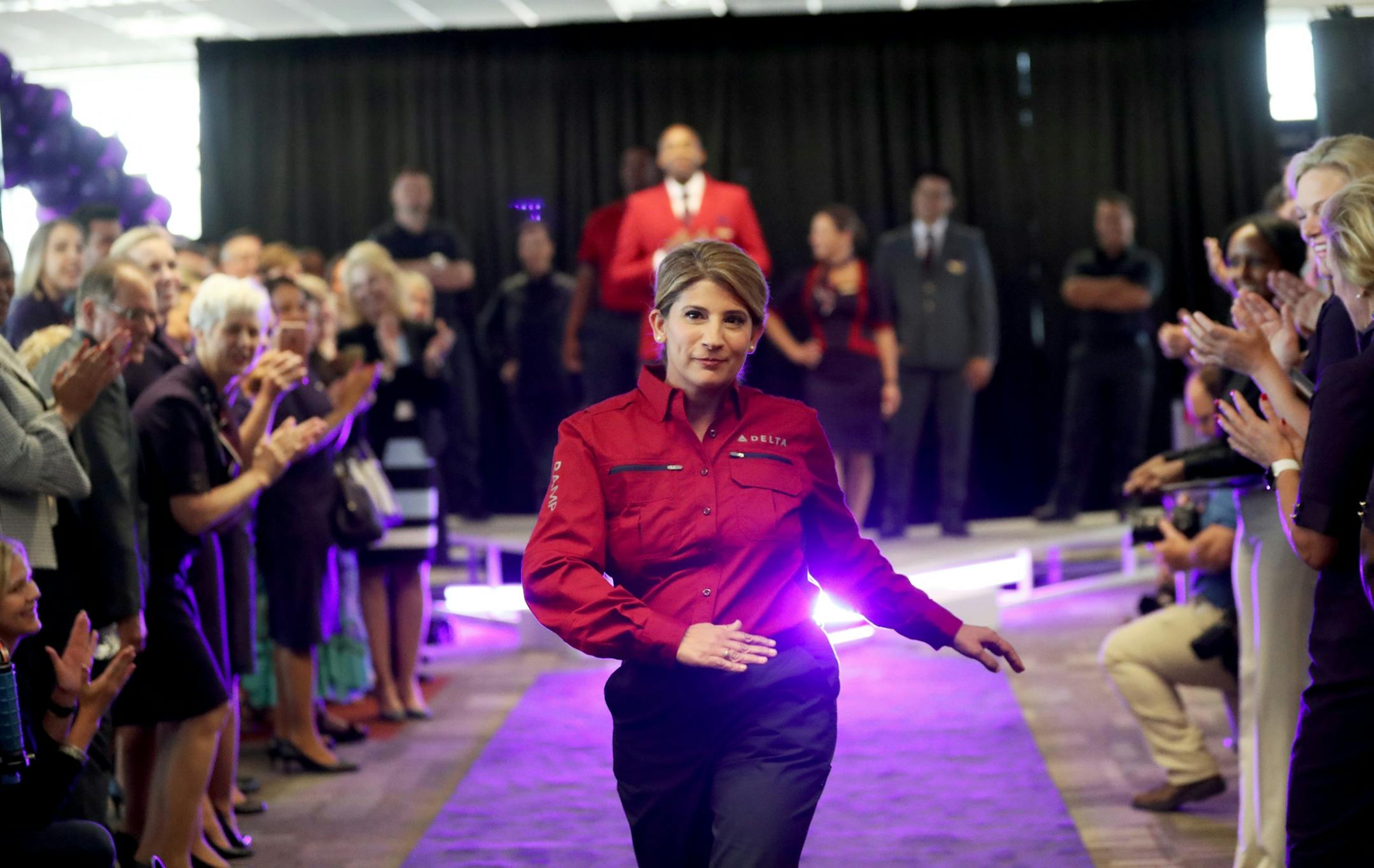 Delta Air Lines launched its new line of uniforms for all its employees during a fashion show at MSP with designer Zac Posen & manufacturer Lands End showcasing the new look Tuesday, May, 29, 2018, at Terminal 1 between Gates G1-G3 at the Minneapolis-St. Paul International Airport in Bloomington, MN. Here, a Delta employee walks the runway.