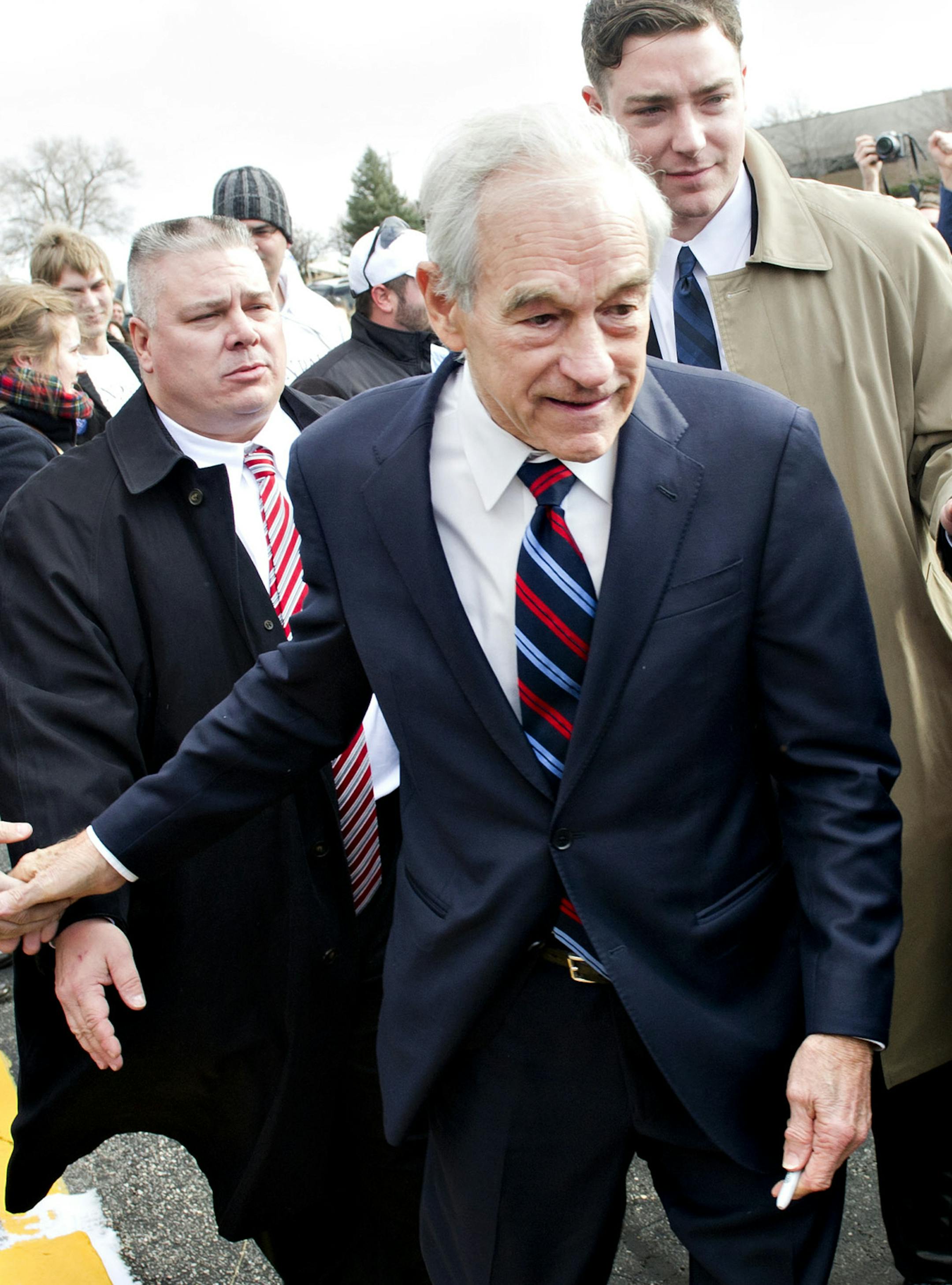 Rep. Ron Paul (R-Texas), a candidate for the Republican presidential nomination, leaves a campaign event at the SteepleGate Inn in Davenport, Iowa, Jan. 2, 2012. Paul and the other five GOP contenders are fanning out across Iowa in rallies and meet-and-greets today in final push to woo the state's fickle voters before the Tuesday caucus. (Daniel Acker/The New York Times)