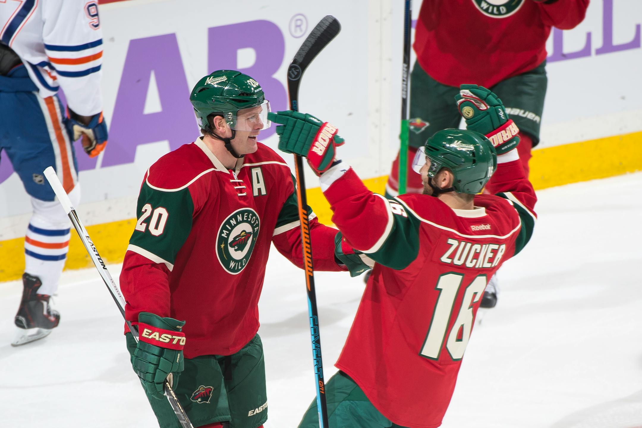Minnesota Wild defenseman Ryan Suter (20) and left wing Jason Zucker (16) celebrated a goal by Suter in the first period against Edmonton.