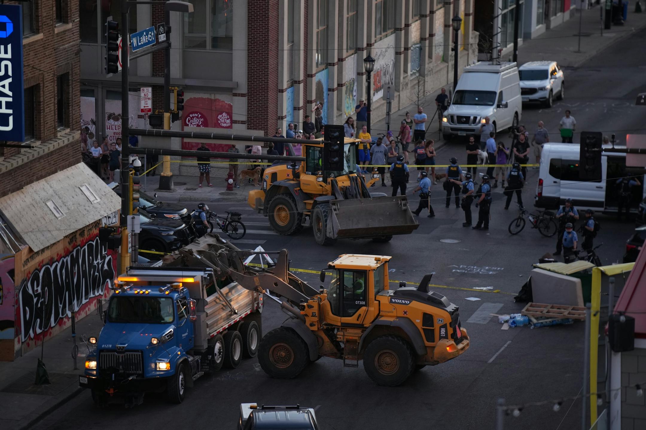 Minneapolis Police descended on the block long stretch of Lake St. in Uptown just before sunset Tuesday night, June 15, 2021 to dismantle the barricades erected by protesters.